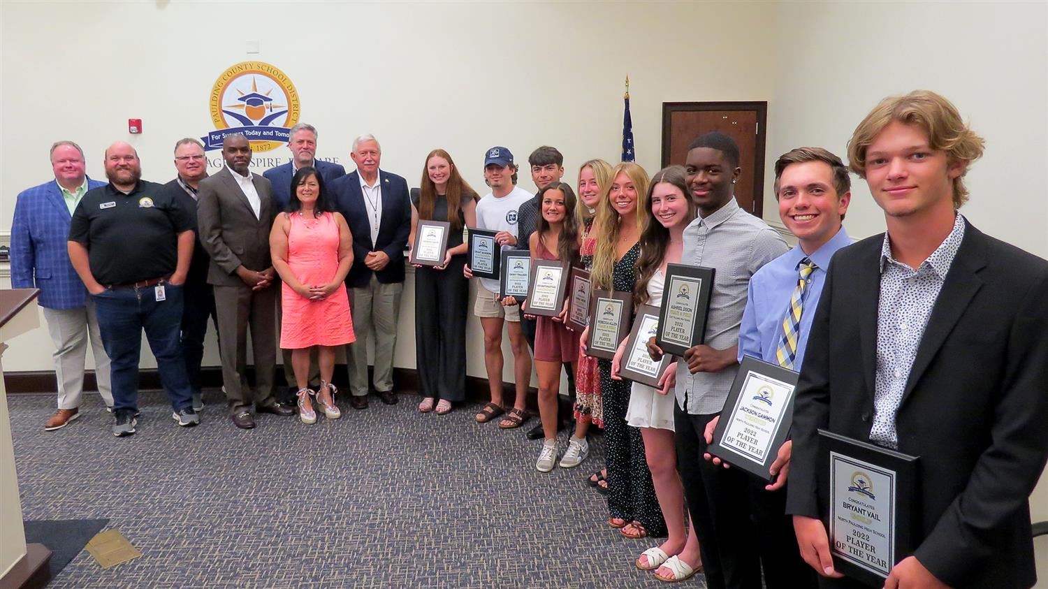 Group photo athletes of the year with school board