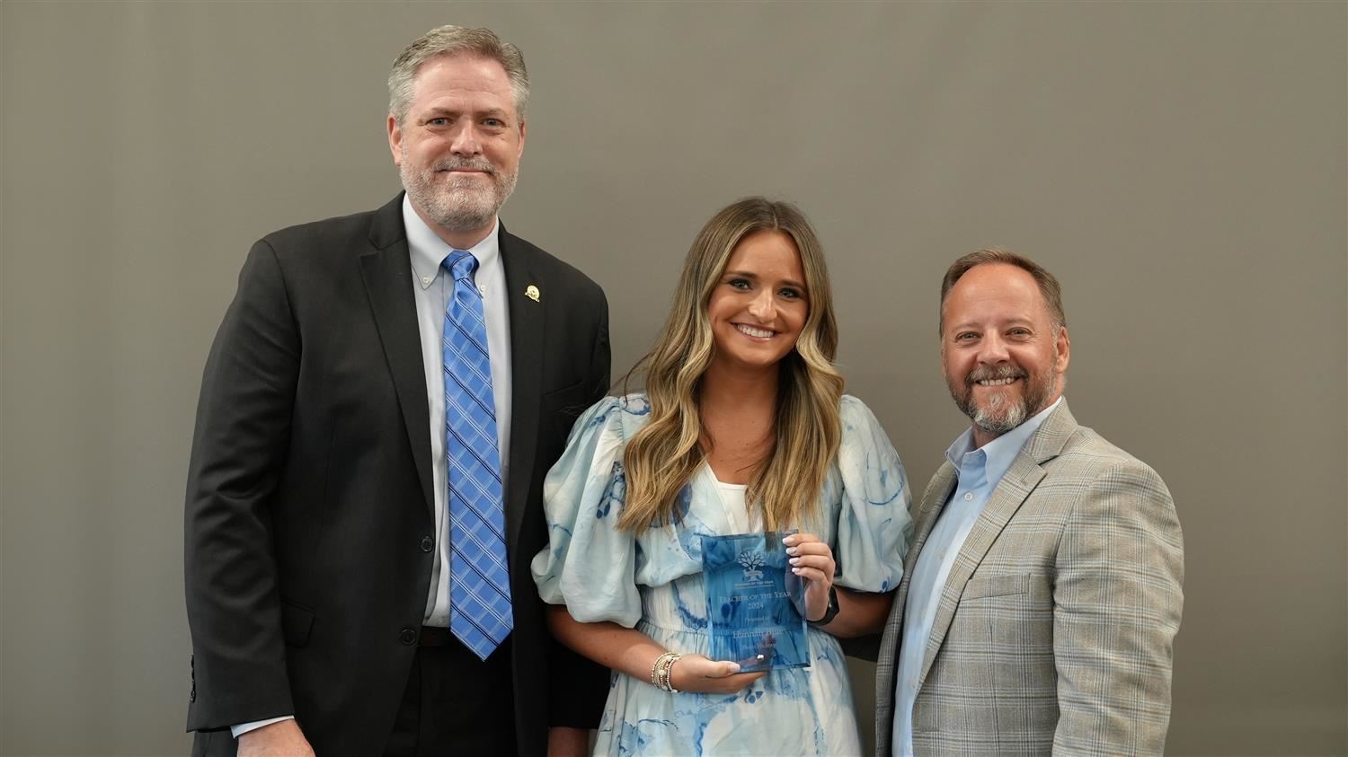 Burnt Hickory Elementary Teacher of the Year Hannah Blue pictured with Superintendent Steve Barnette and Paulding Education F