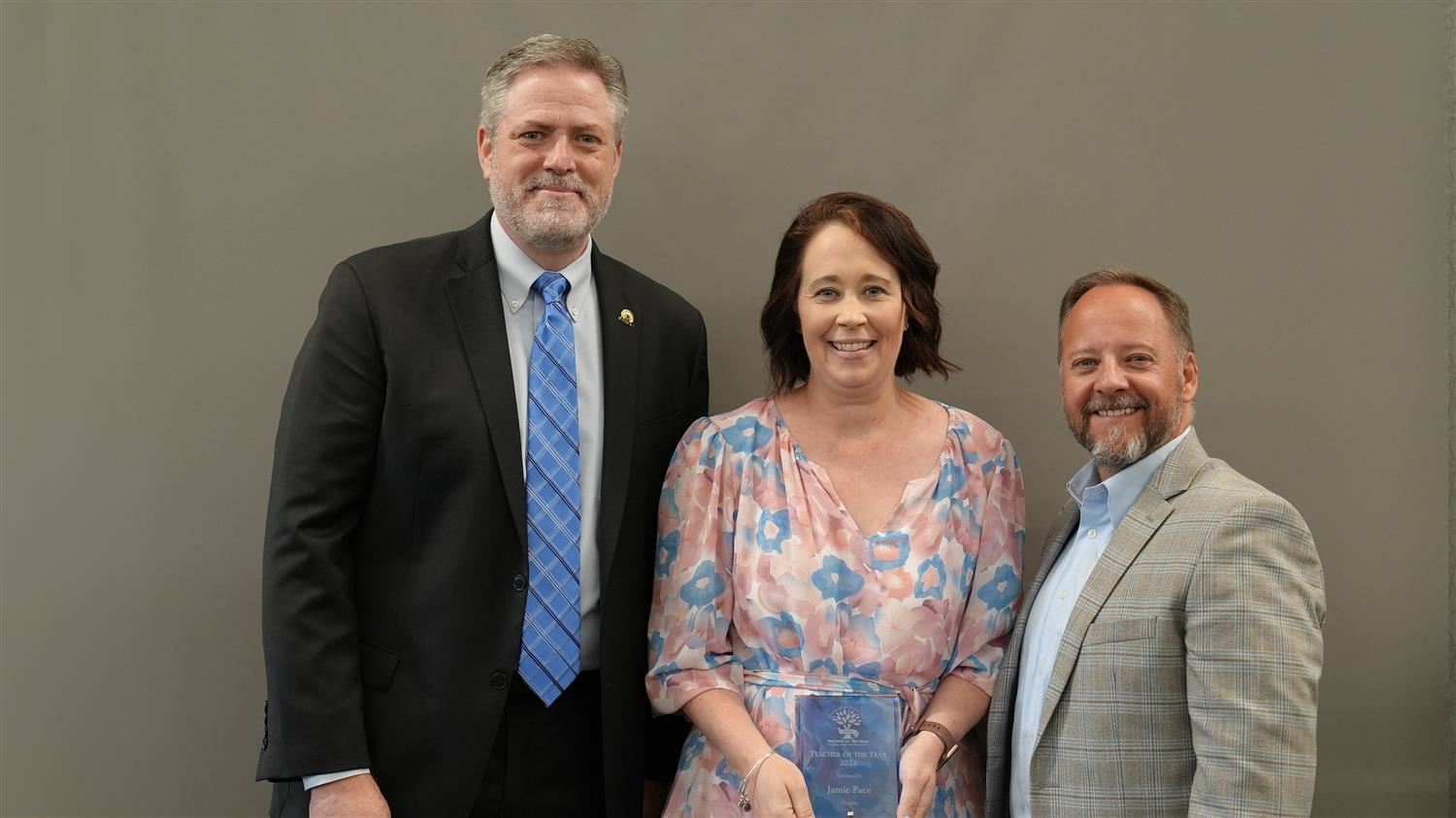 Dugan Elementary Teacher of the Year Jamie Pace pictured with Superintendent Steve Barnette and Paulding Education Foundation