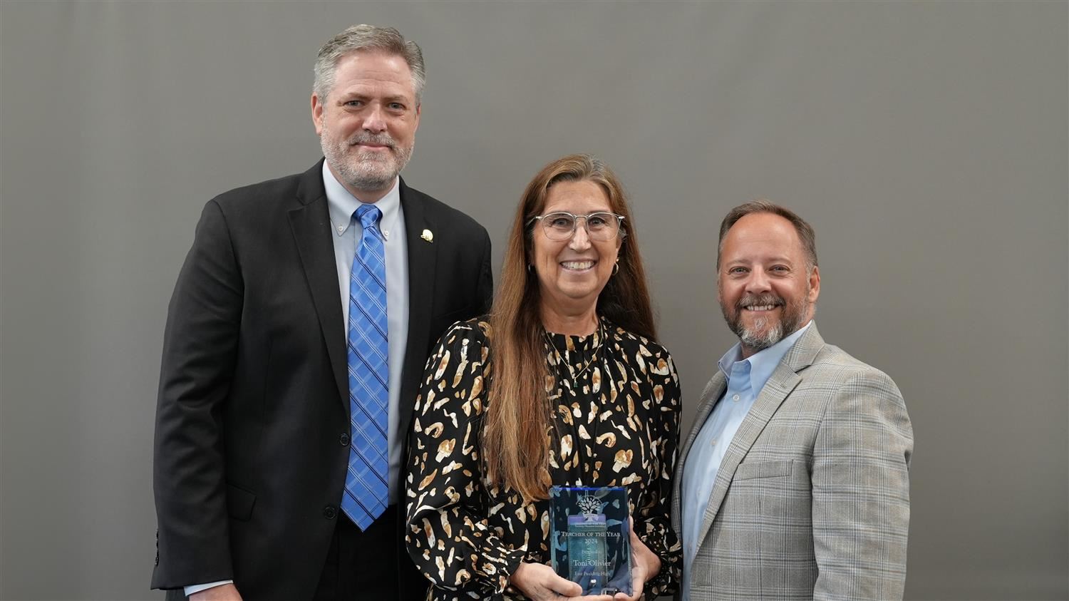 East Paulding High School Teacher of the Year Toni Olivier pictured with Superintendent Steve Barnette and Paulding Education