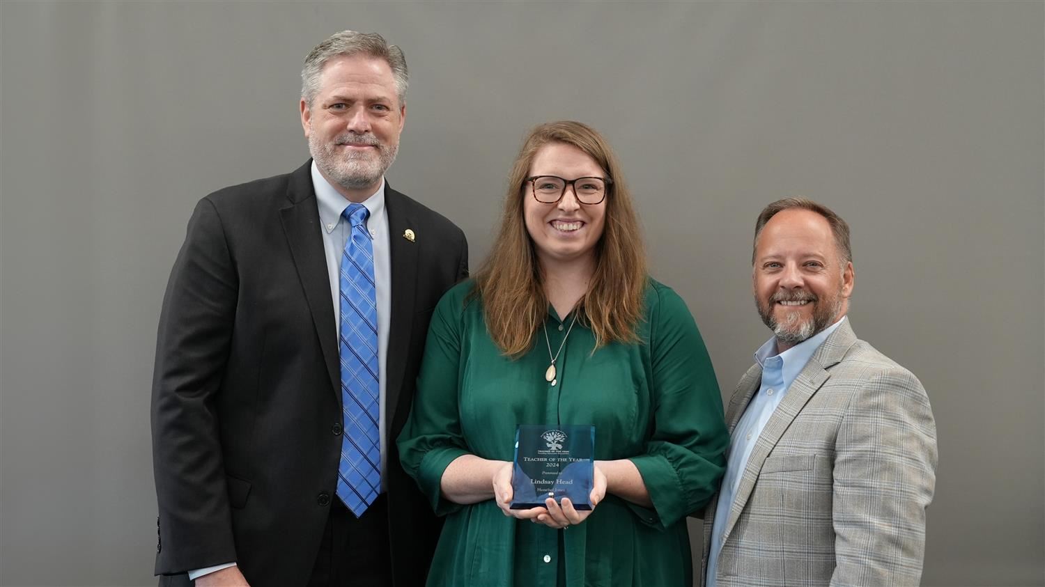 Herschel Jones Middle School Teacher of the Year Lindsay Head pictured with Superintendent Steve Barnette and Paulding Educat