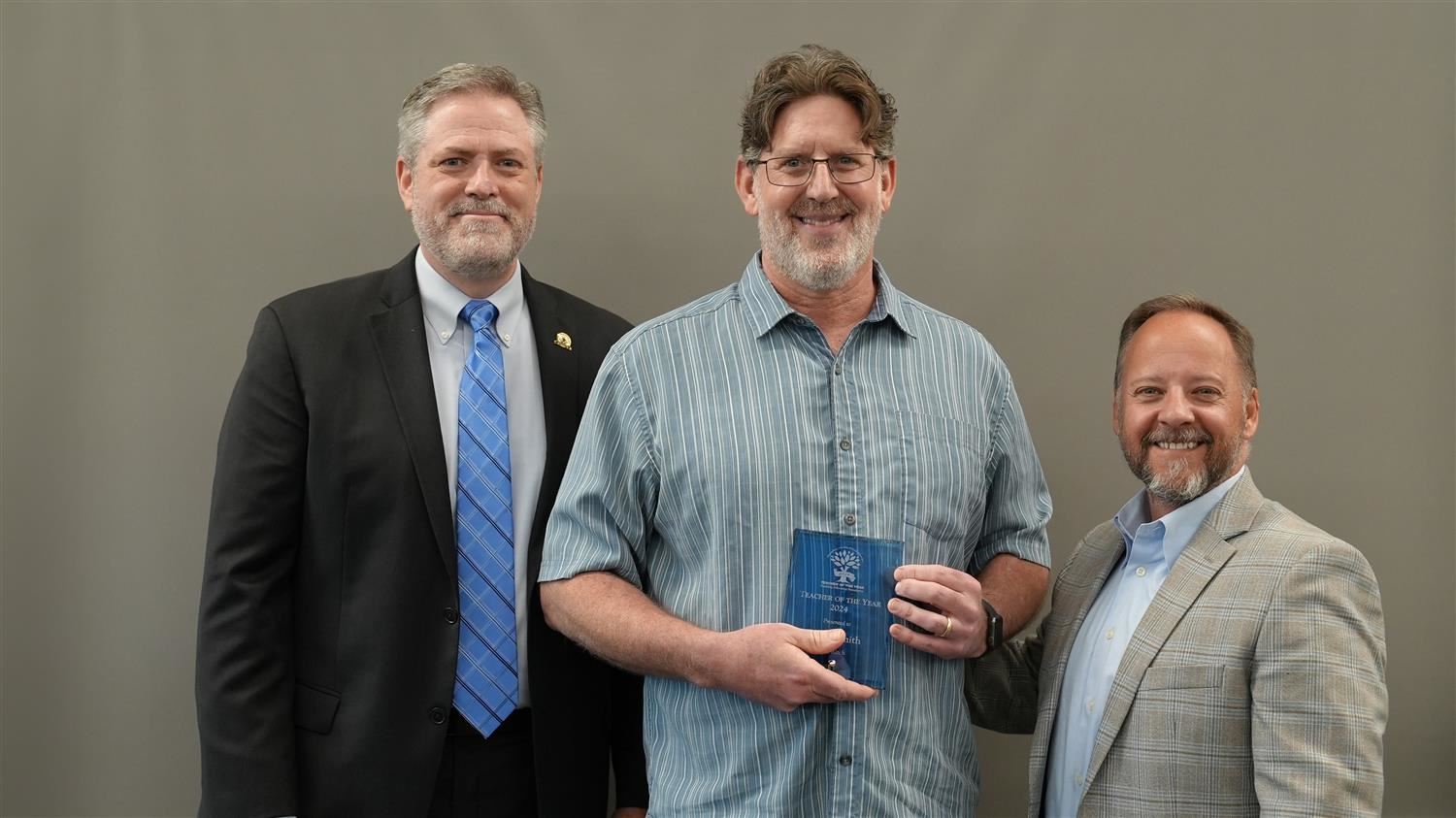 P.B. Ritch Middle School Teacher of the Year Andy Smith pictured with Superintendent Steve Barnette and Paulding Education Fo