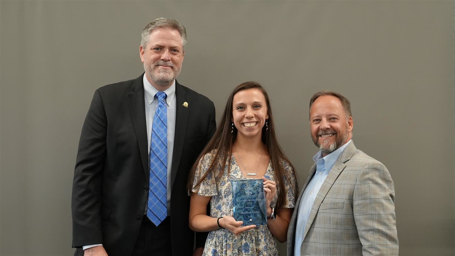 Poole Elementary Teacher of the Year Madison Gates pictured with Superintendent Steve Barnette and Paulding Education Foundat