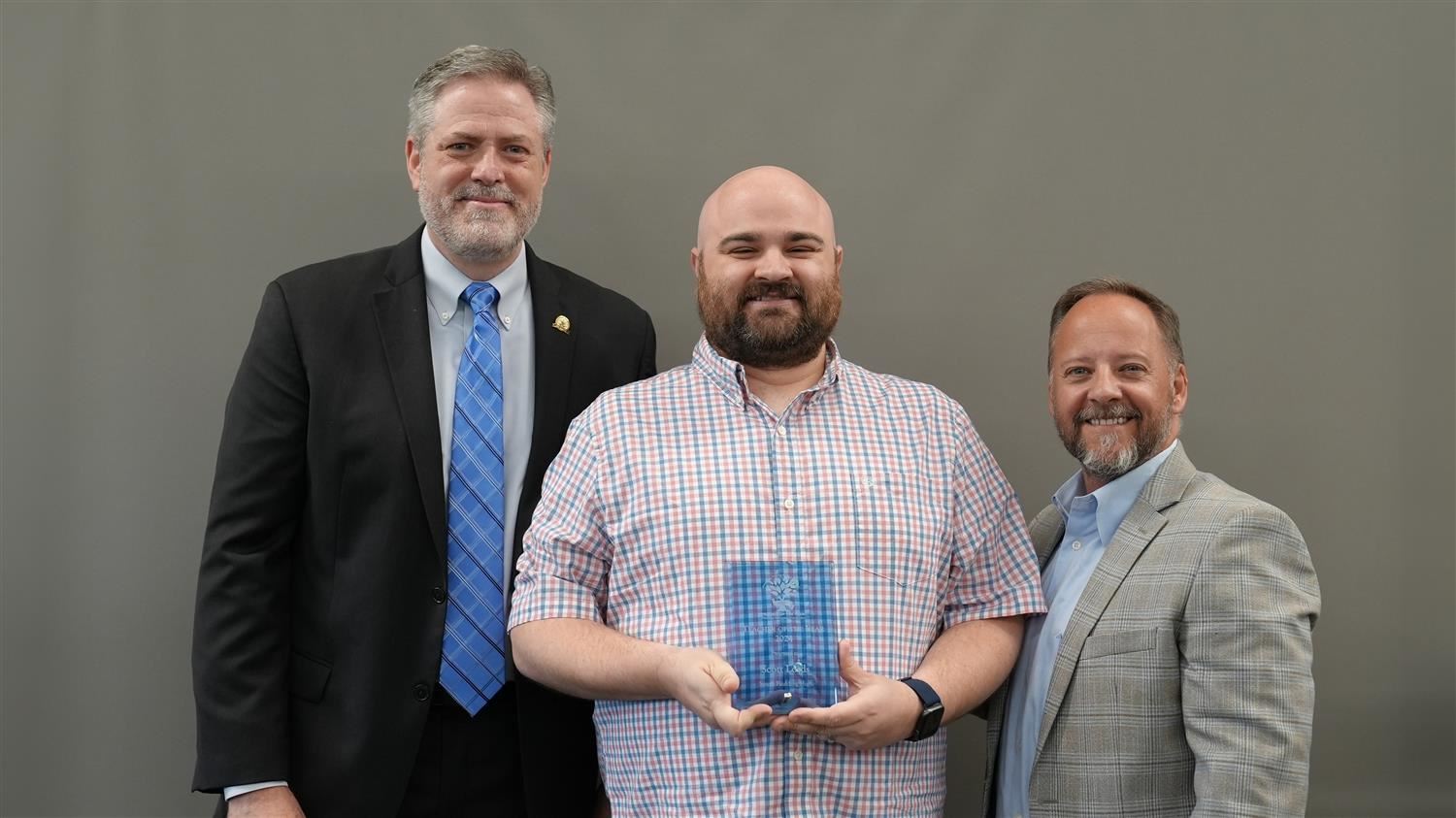 South Paulding High School Teacher of the Year Scott Lords pictured with Superintendent Steve Barnette and Paulding Education Foundation Board member Jim McMichen.