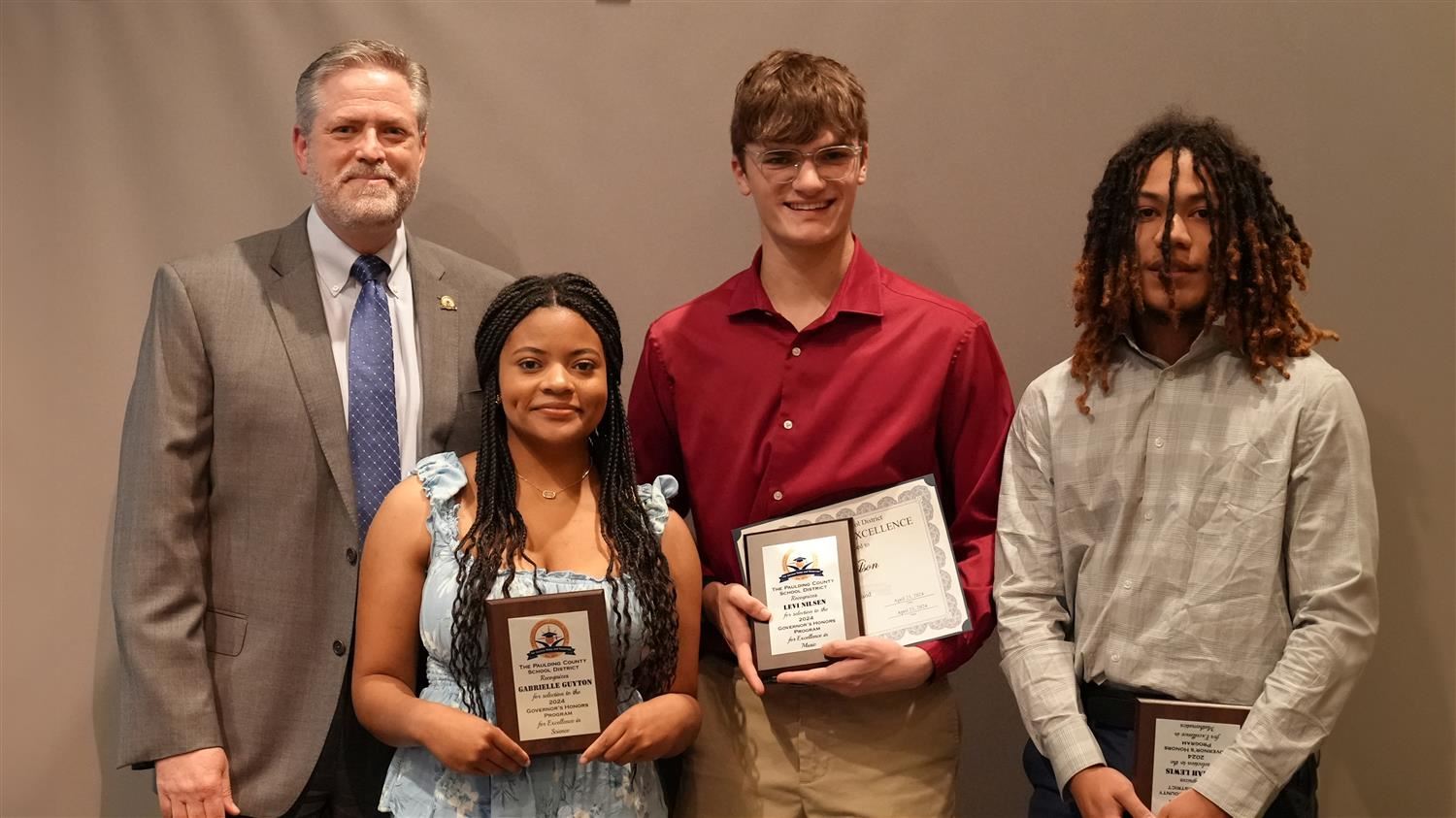 Superintendent Steve Barnette pictured with Governor's Honors winners Gabrielle Guyton (PCHS - Biology), Levi Nilsen (EPHS - Music/Trumpet) and Jaimiah Lewis (NPHS - Mathematics).