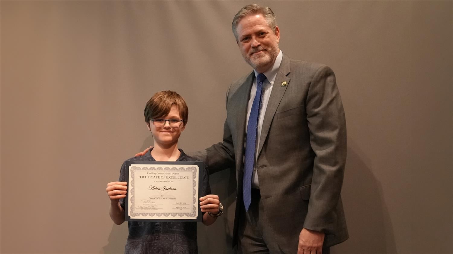 Superintendent Steve Barnette pictured with Visual Art winner Poole ES 5th grader Arkin Jackson.