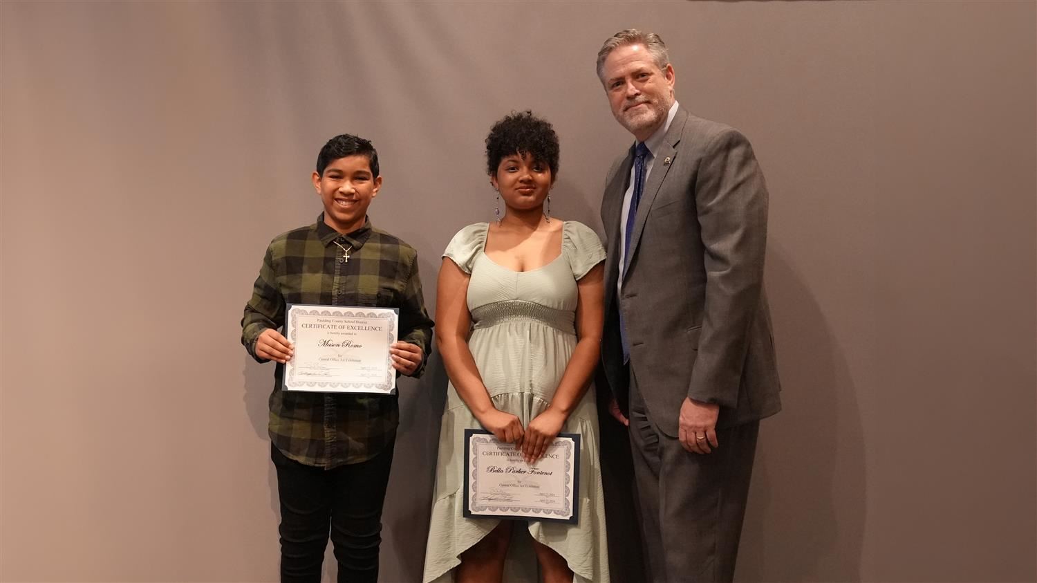 Superintendent Steve Barnette pictured with Visual Art winners Ritch MS 7th grader Mason Romo and Moses MS 8th grader Bella Parker Fontenot.