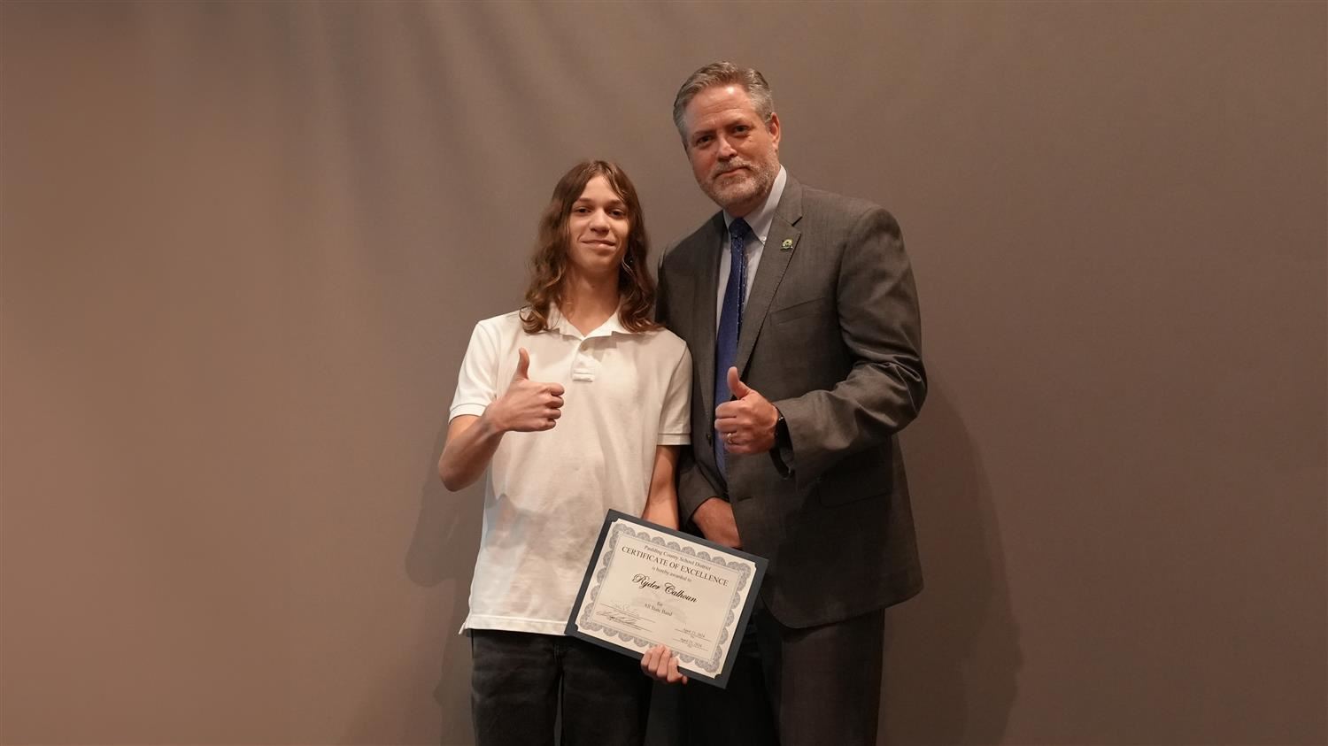 Superintendent Steve Barnette pictured with All State winner South Paulding HS 10th grader Ryder Calhoun.