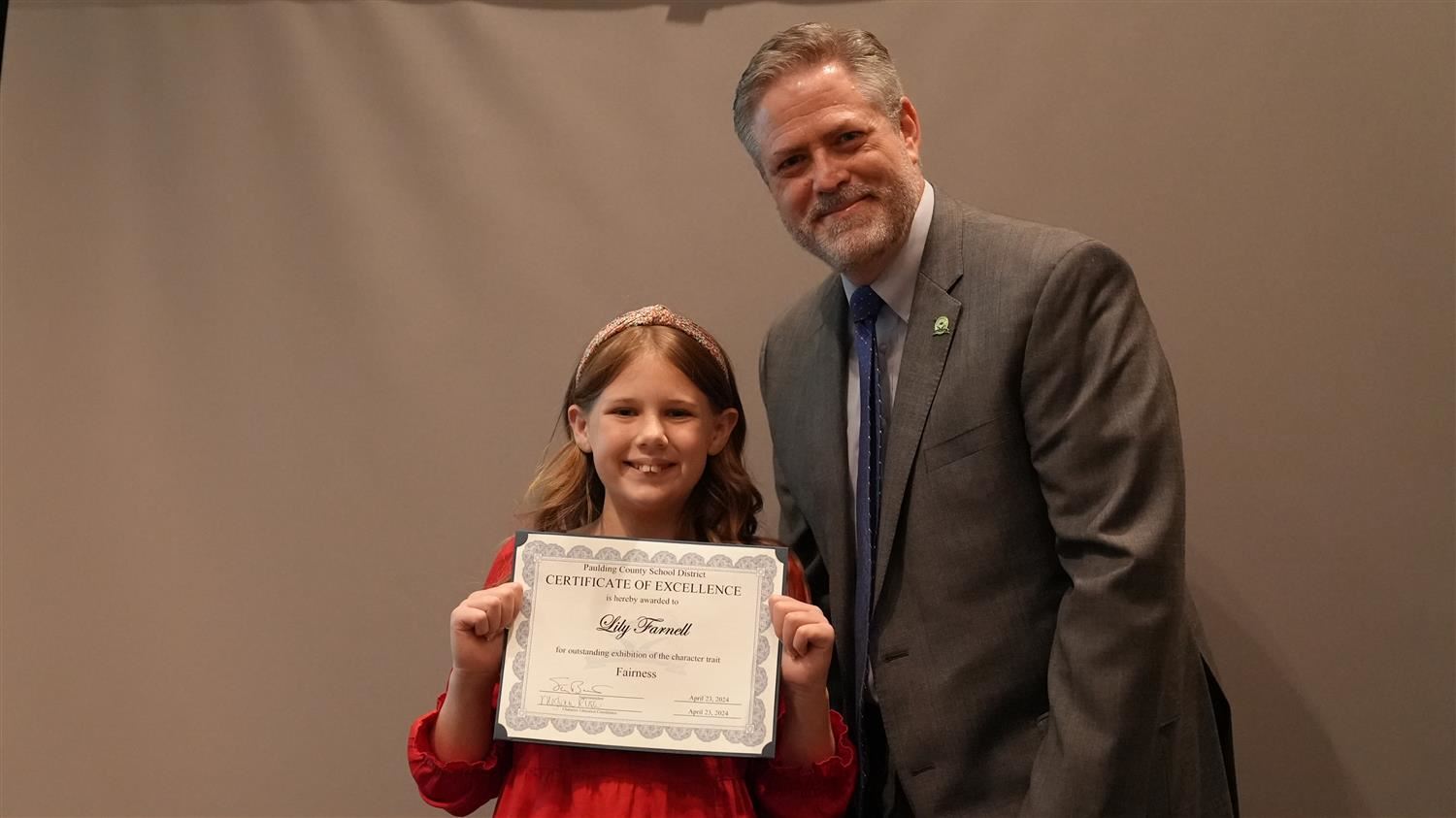 Superintendent Steve Barnette pictured with Character in Action (Fairness) winner Russom ES 4th grader Lily Farnell.