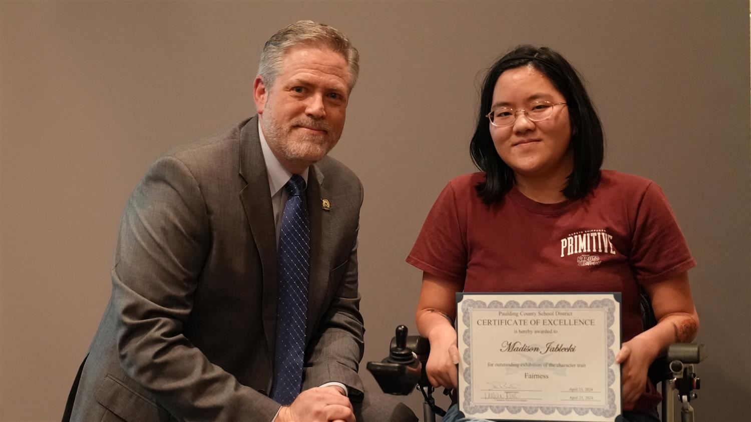 Superintendent Steve Barnette pictured with Character in Action (Fairness) winner North Paulding HS 11th grader Madison Jablecki.