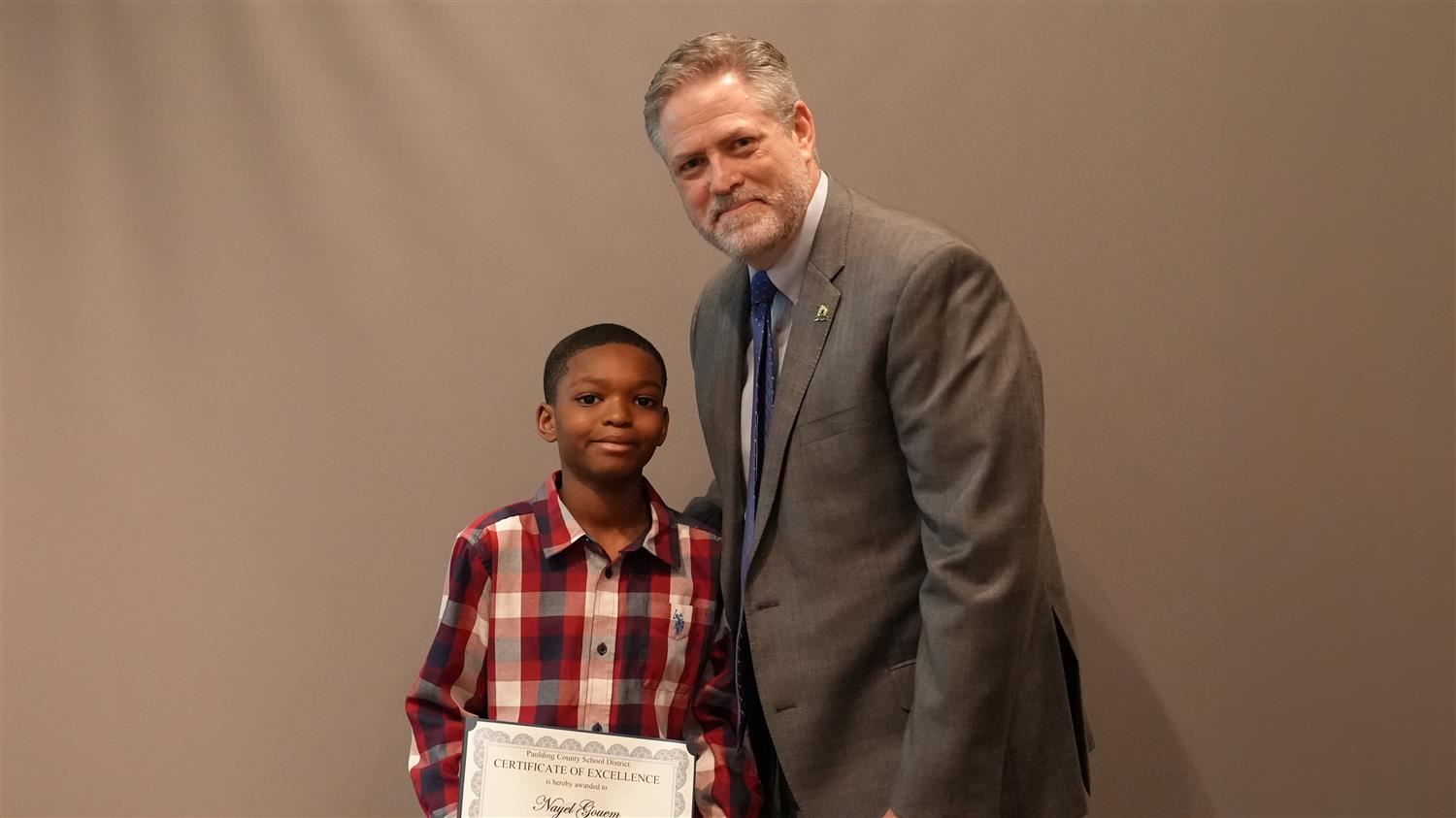 Superintendent Steve Barnette pictured with Character in Action (Tolerance) winner McGarity ES 4th grader Nayel Gouem.