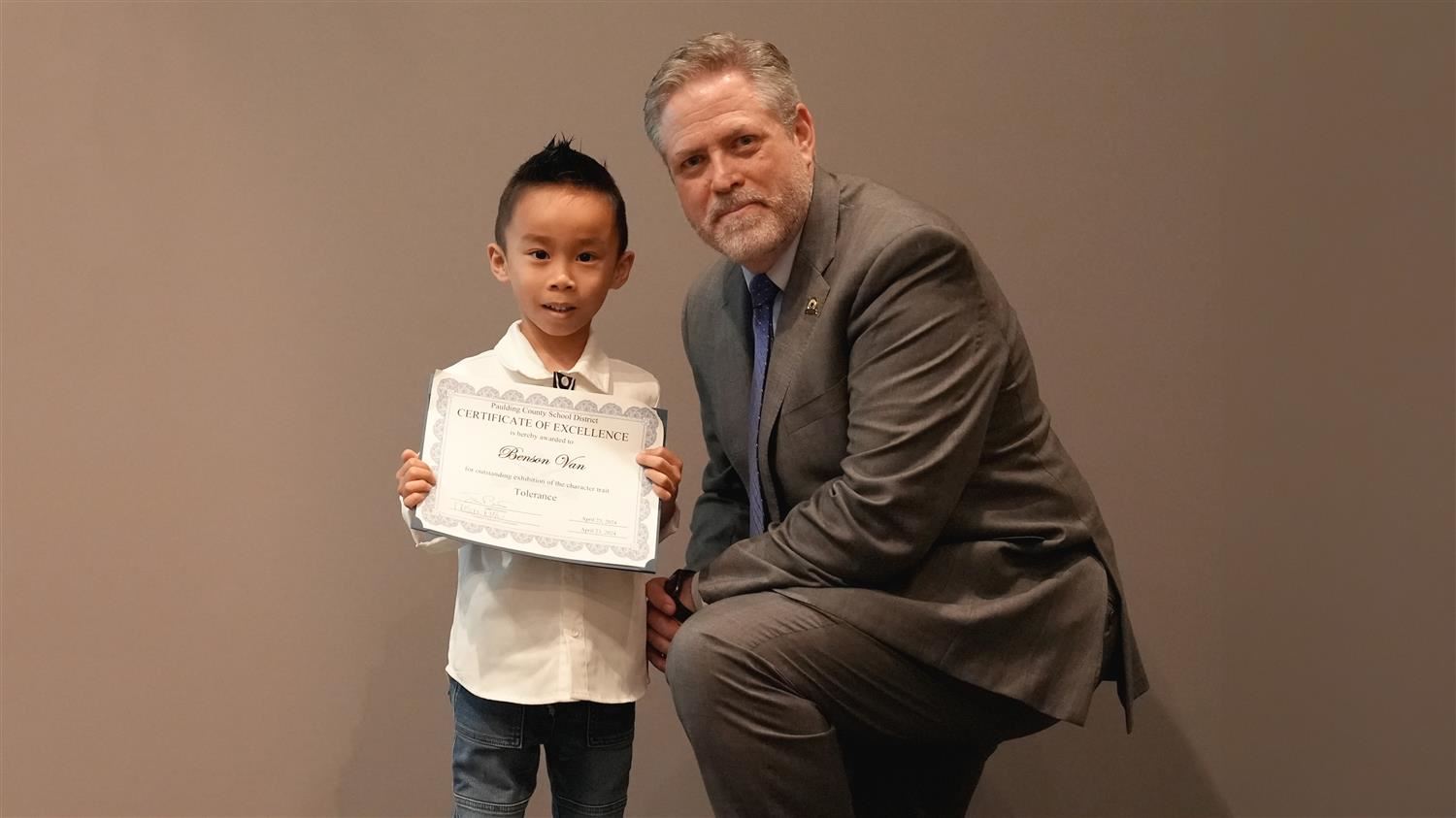 Superintendent Steve Barnette pictured with Character in Action (Tolerance) winner Roberts ES Kindergartener Benson Van.