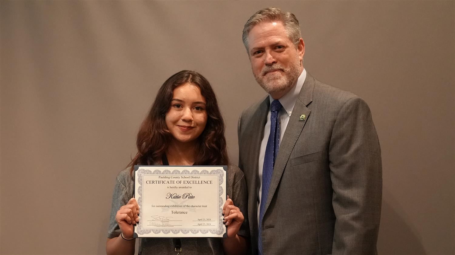 Superintendent Steve Barnette pictured with Character in Action (Tolerance) winner East Paulding HS 10th grader Katie Pate.