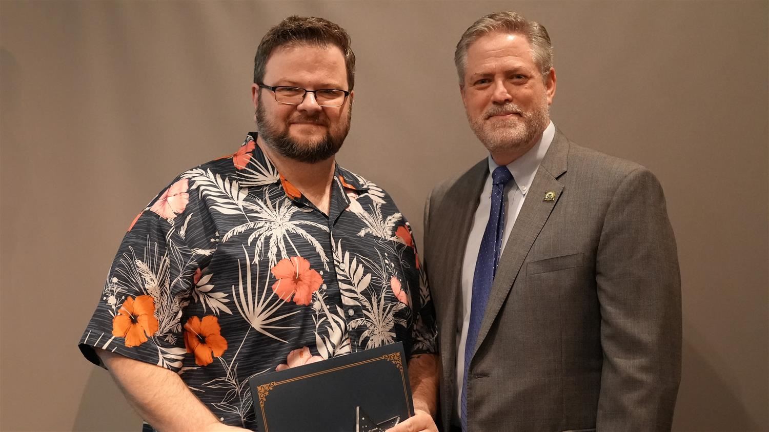 Superintendent Steve Barnette pictured with February 2024 Star Staff winner PCCA Cybersecurity Teacher Leon Bowers.