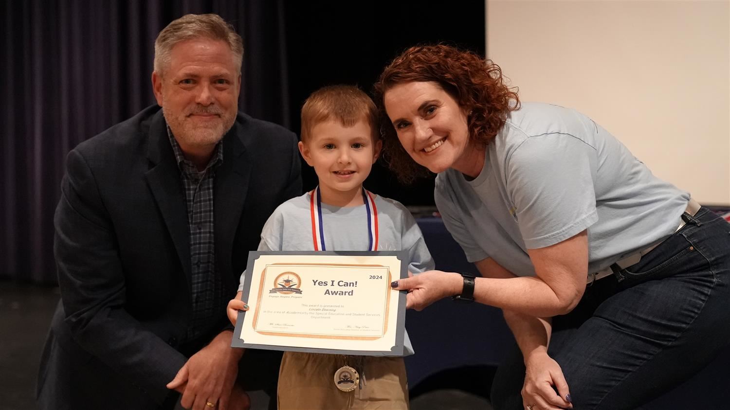 Lincoln Downing from Abney ES pictured with Superintendent Steve Barnette and Senior Executive Director of Student Services A