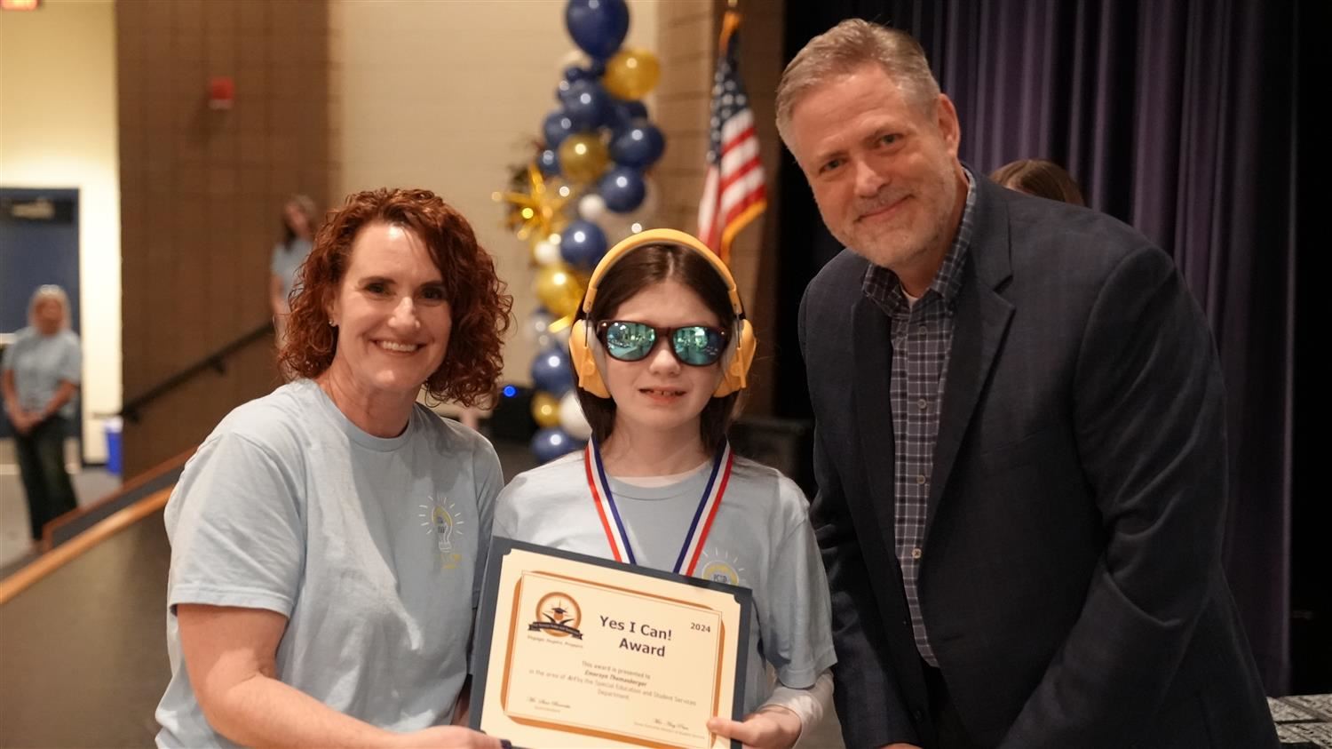 Emersyn Thomasberger from Abney ES pictured with Superintendent Steve Barnette and Senior Executive Director of Student Servi