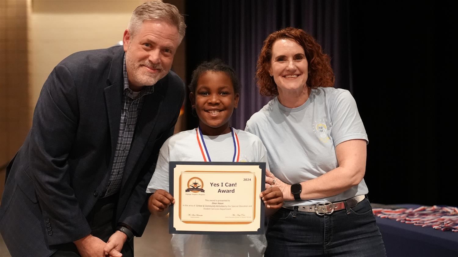 Omar Hasan from Burnt Hickory ES pictured with Superintendent Steve Barnette and Senior Executive Director of Student Service