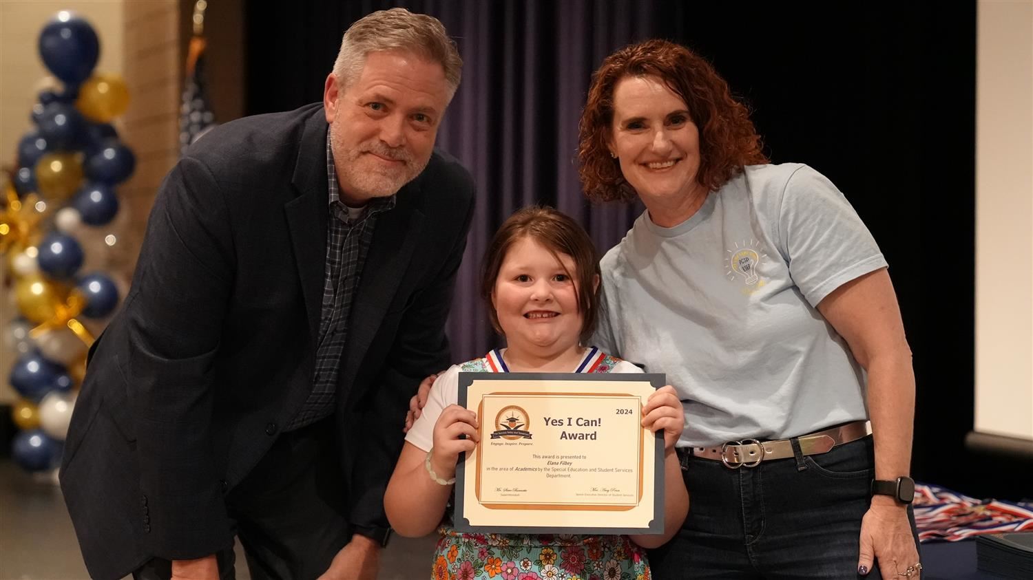 Elana Filbey from Dallas ES pictured with Superintendent Steve Barnette and Senior Executive Director of Student Services Amy