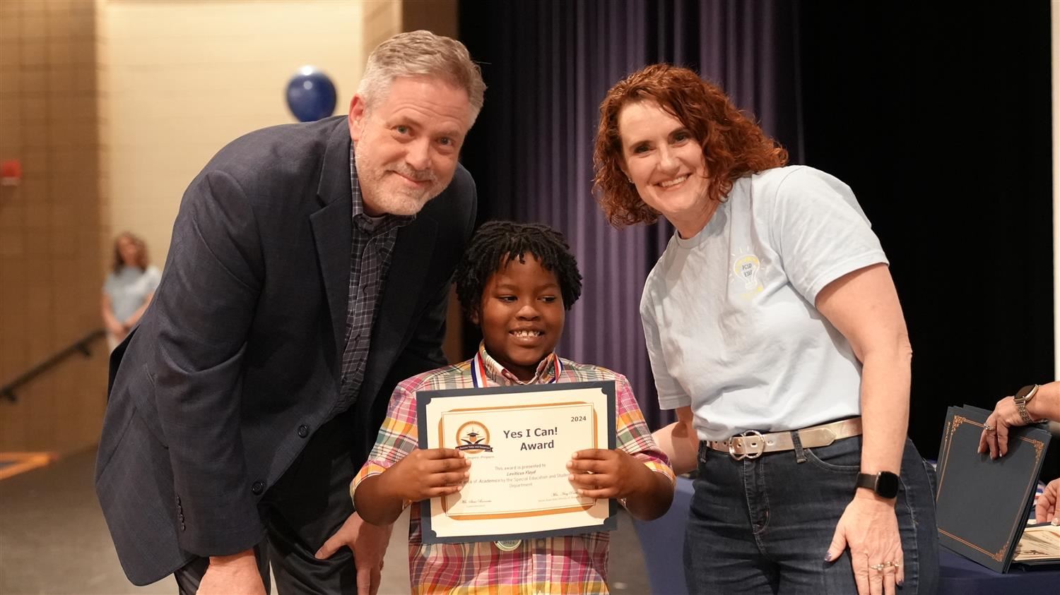 Leviticus Floyd from Dugan ES pictured with Superintendent Steve Barnette and Senior Executive Director of Student Services A