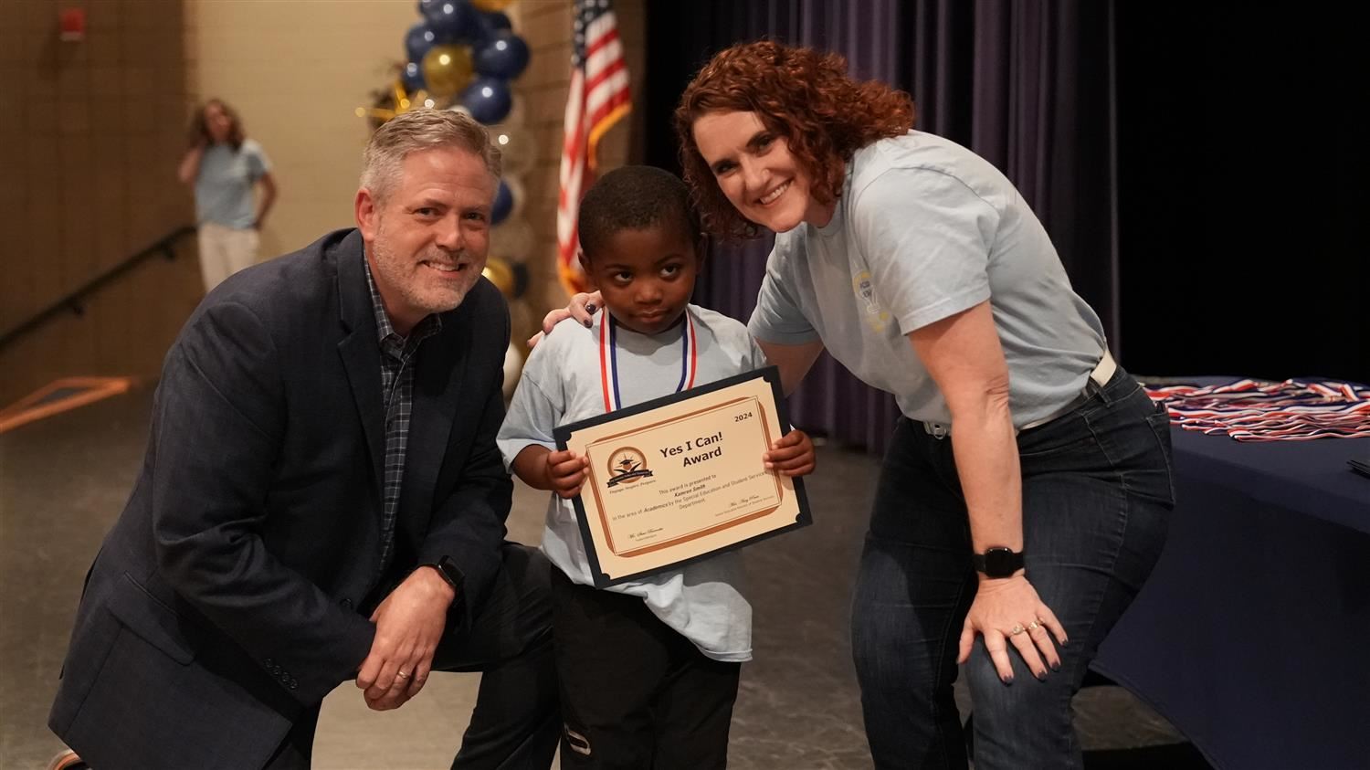 Kamren Smith from Poole ES pictured with Superintendent Steve Barnette and Senior Executive Director of Student Services Amy 