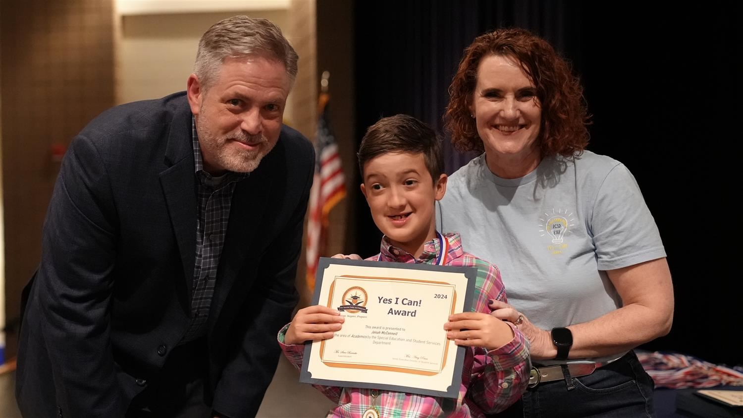 Jonah McConnell from Dugan ES pictured with Superintendent Steve Barnette and Senior Executive Director of Student Services A
