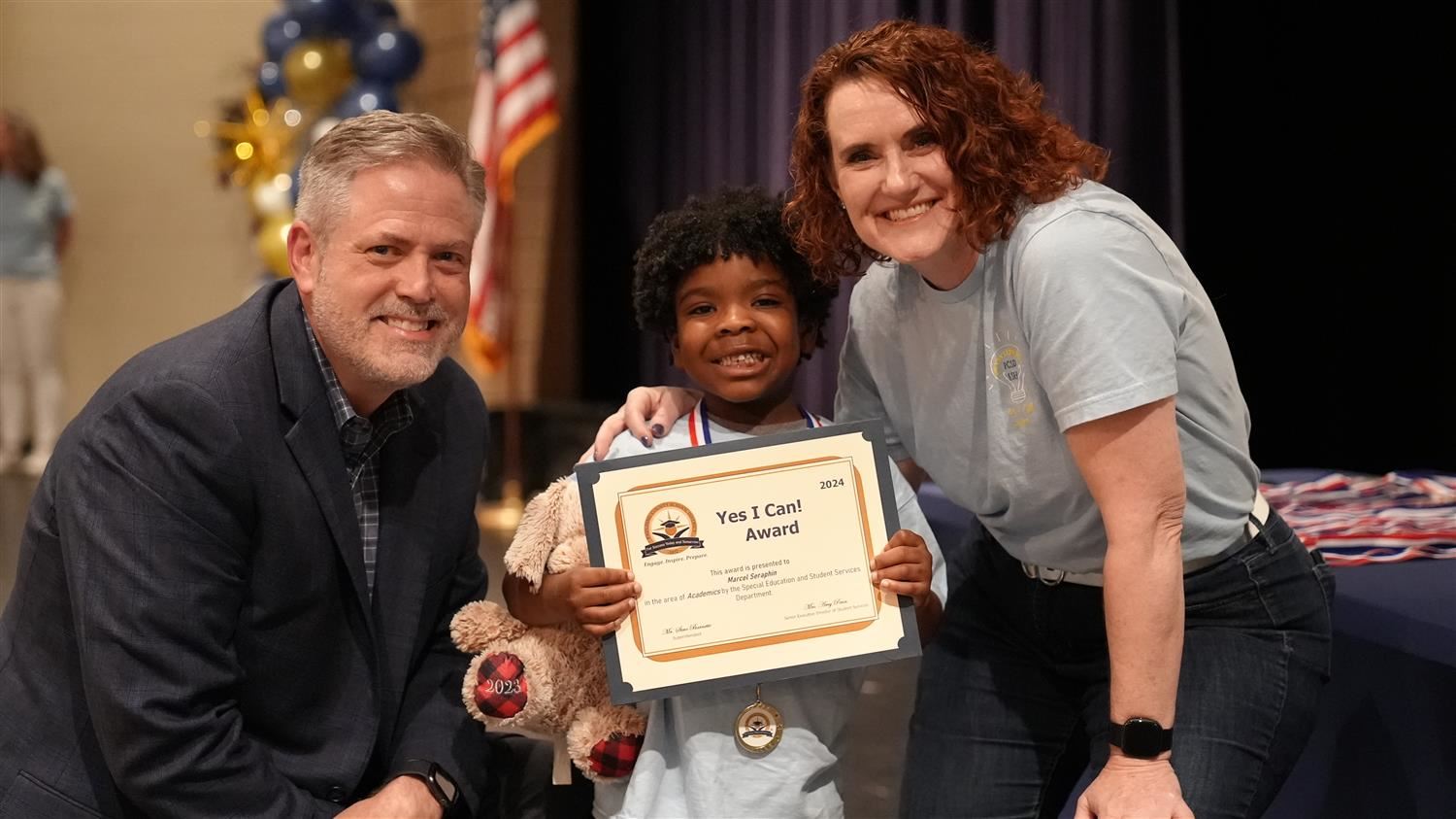 Marcel Seraphin from Dugan ES pictured with Superintendent Steve Barnette and Senior Executive Director of Student Services Amy Penn.