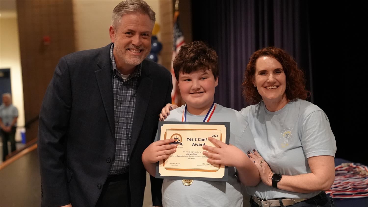 Grayson Bristol from Hiram ES pictured with Superintendent Steve Barnette and Senior Executive Director of Student Services A