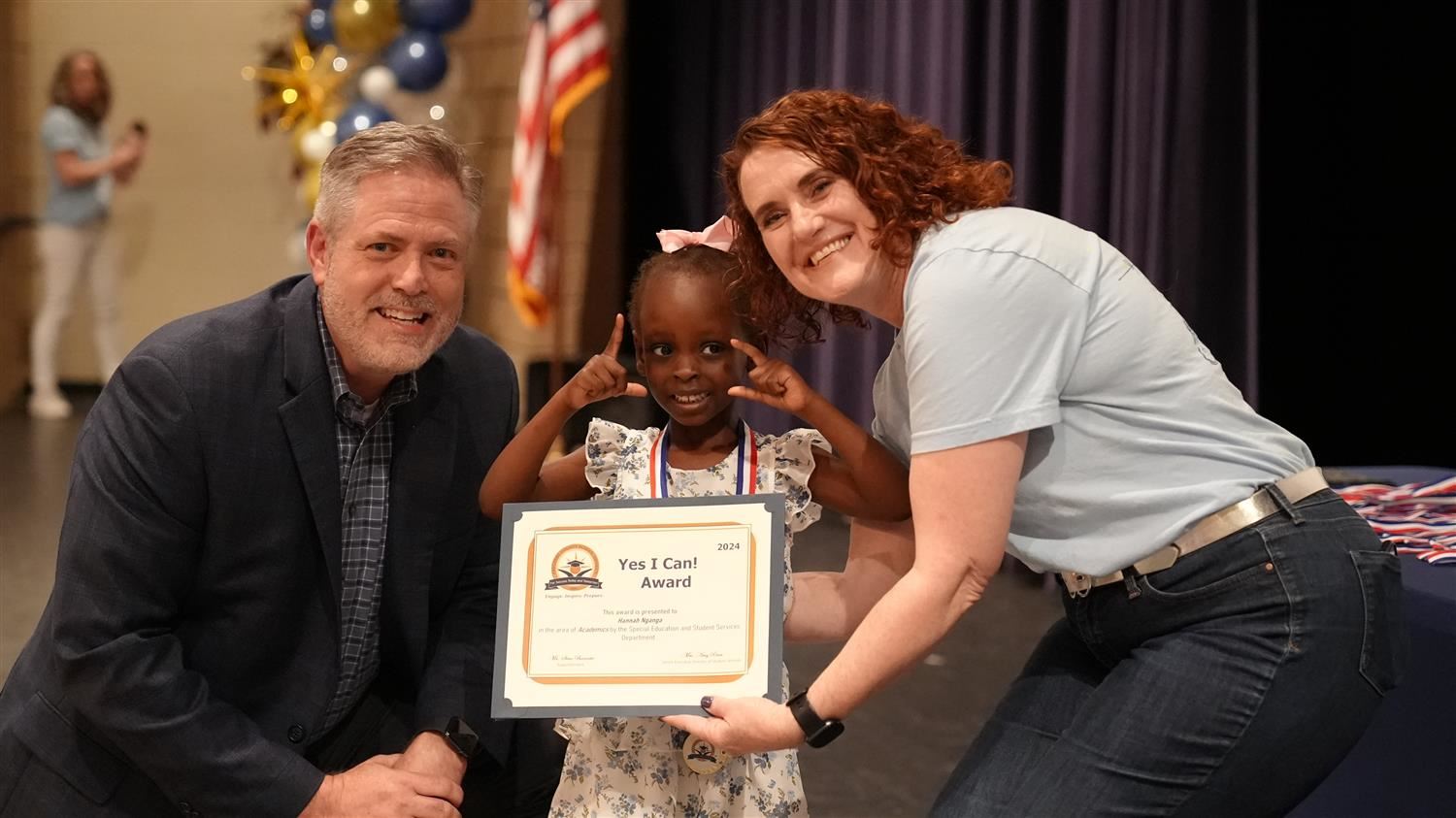 Mykell Walker from Hiram ES pictured with Superintendent Steve Barnette and Senior Executive Director of Student Services Amy
