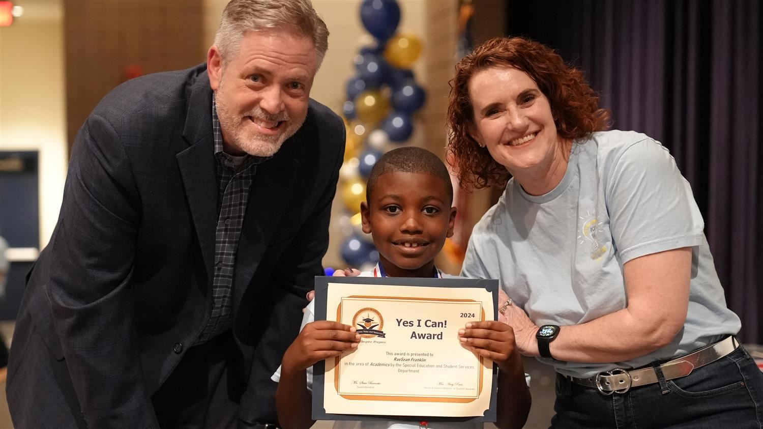RaeSean Franklin from Hutchens ES pictured with Superintendent Steve Barnette and Senior Executive Director of Student Servic
