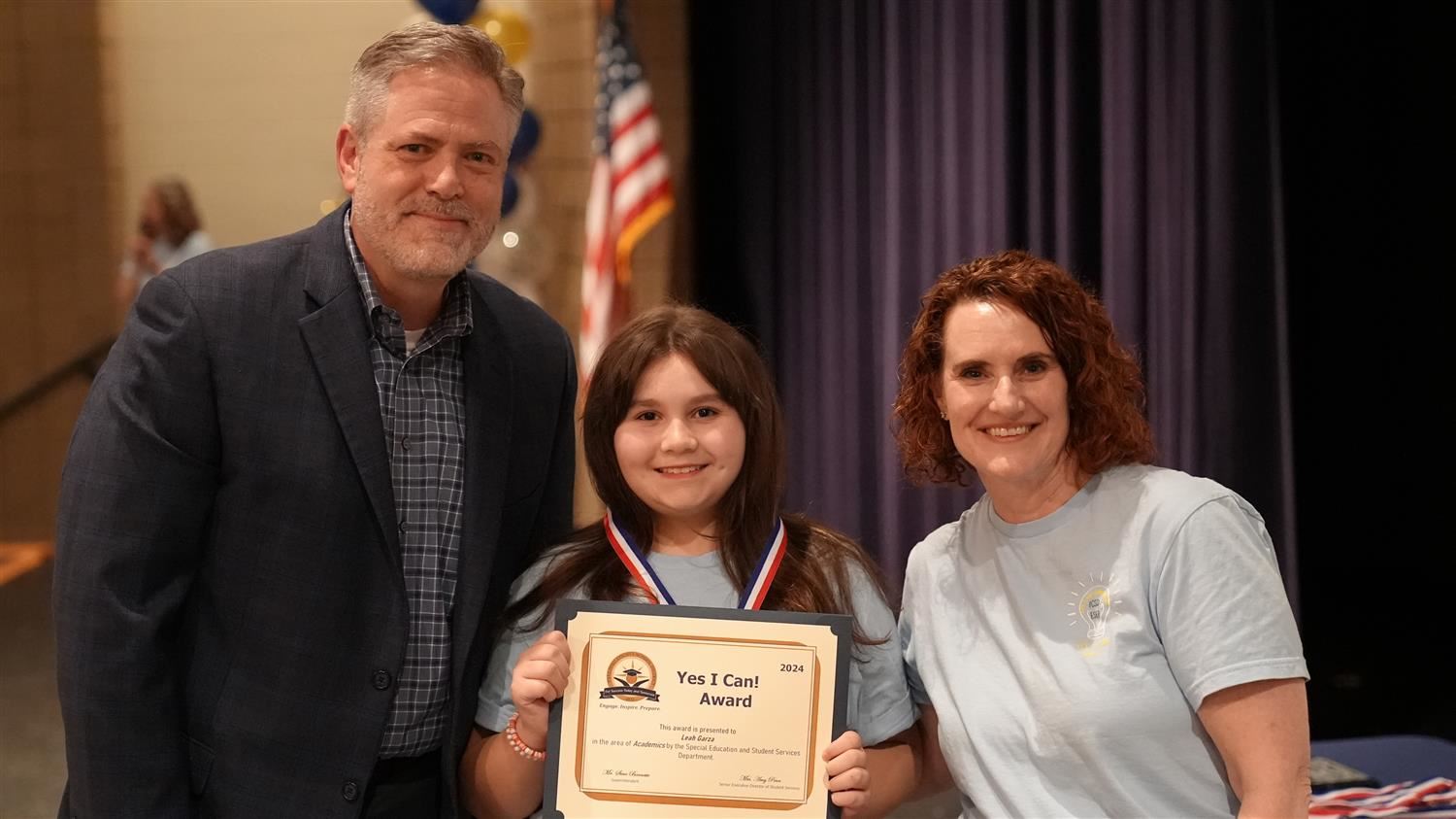 Leah Garza from McGarity ES pictured with Superintendent Steve Barnette and Senior Executive Director of Student Services Amy