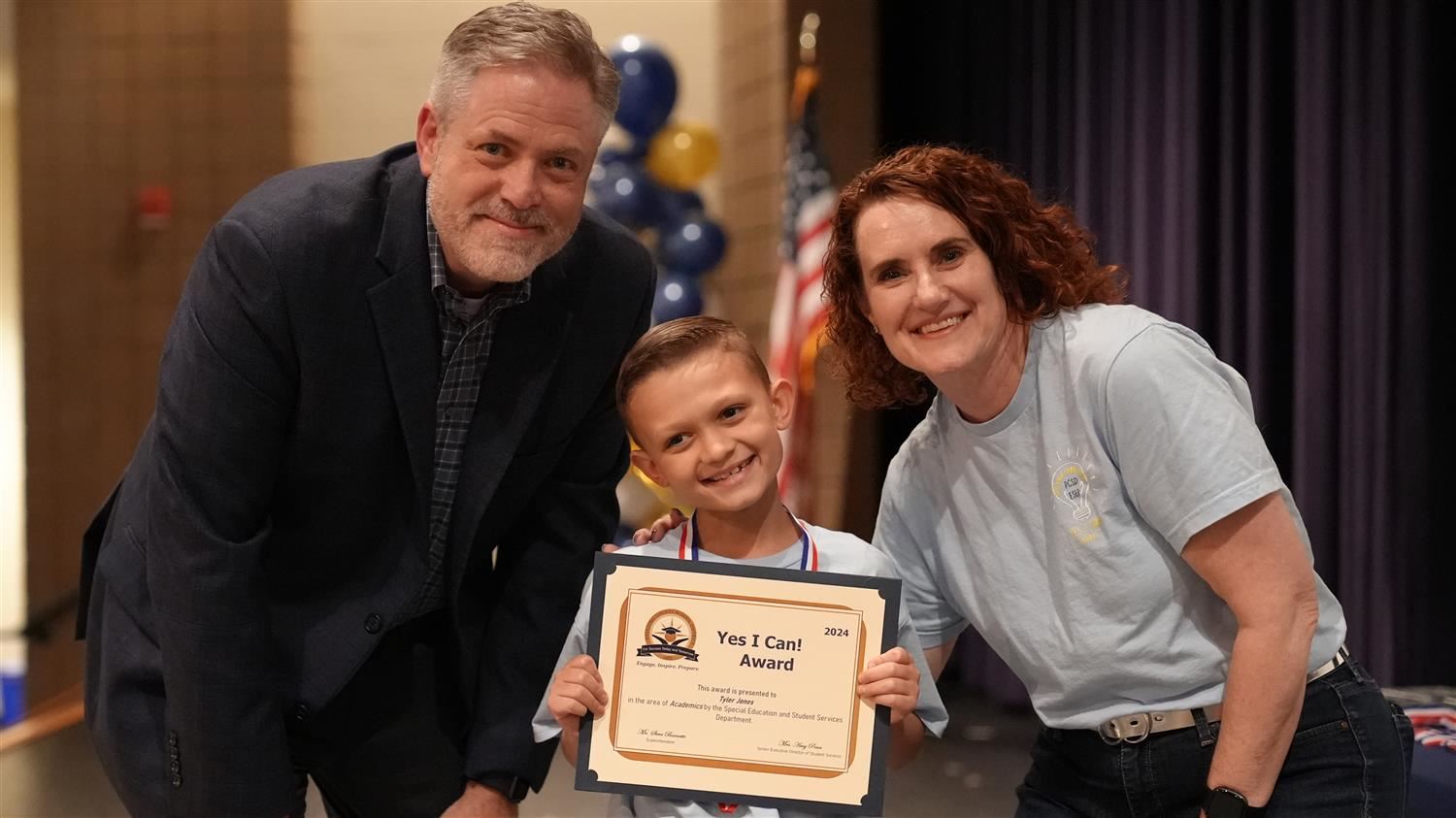 Tyler Jones from McGarity ES pictured with Superintendent Steve Barnette and Senior Executive Director of Student Services Am