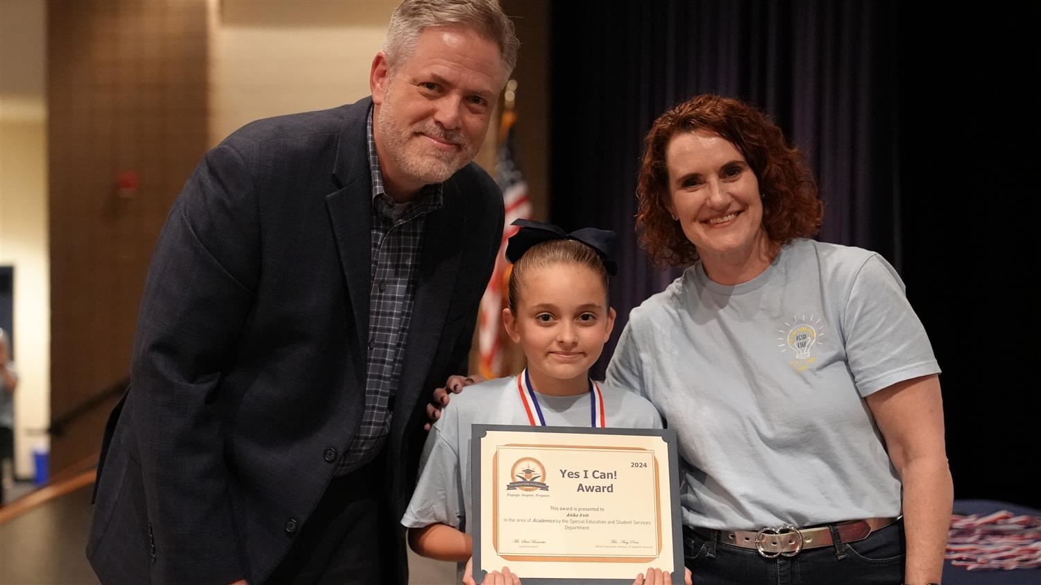 Anika Irvin from Nebo ES pictured with Superintendent Steve Barnette and Senior Executive Director of Student Services Amy Pe