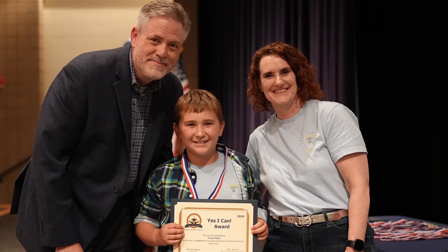 Preston Mathis from Nebo ES pictured with Superintendent Steve Barnette and Senior Executive Director of Student Services Amy