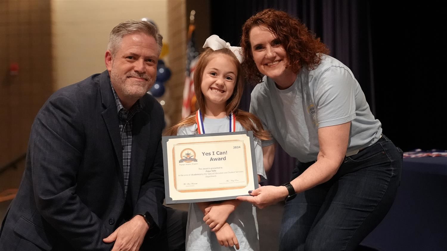Freya Tullis from Nebo ES pictured with Superintendent Steve Barnette and Senior Executive Director of Student Services Amy P
