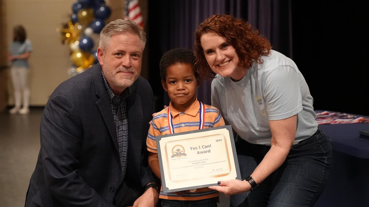 Christopher Drone from Northside ES pictured with Superintendent Steve Barnette and Senior Executive Director of Student Serv