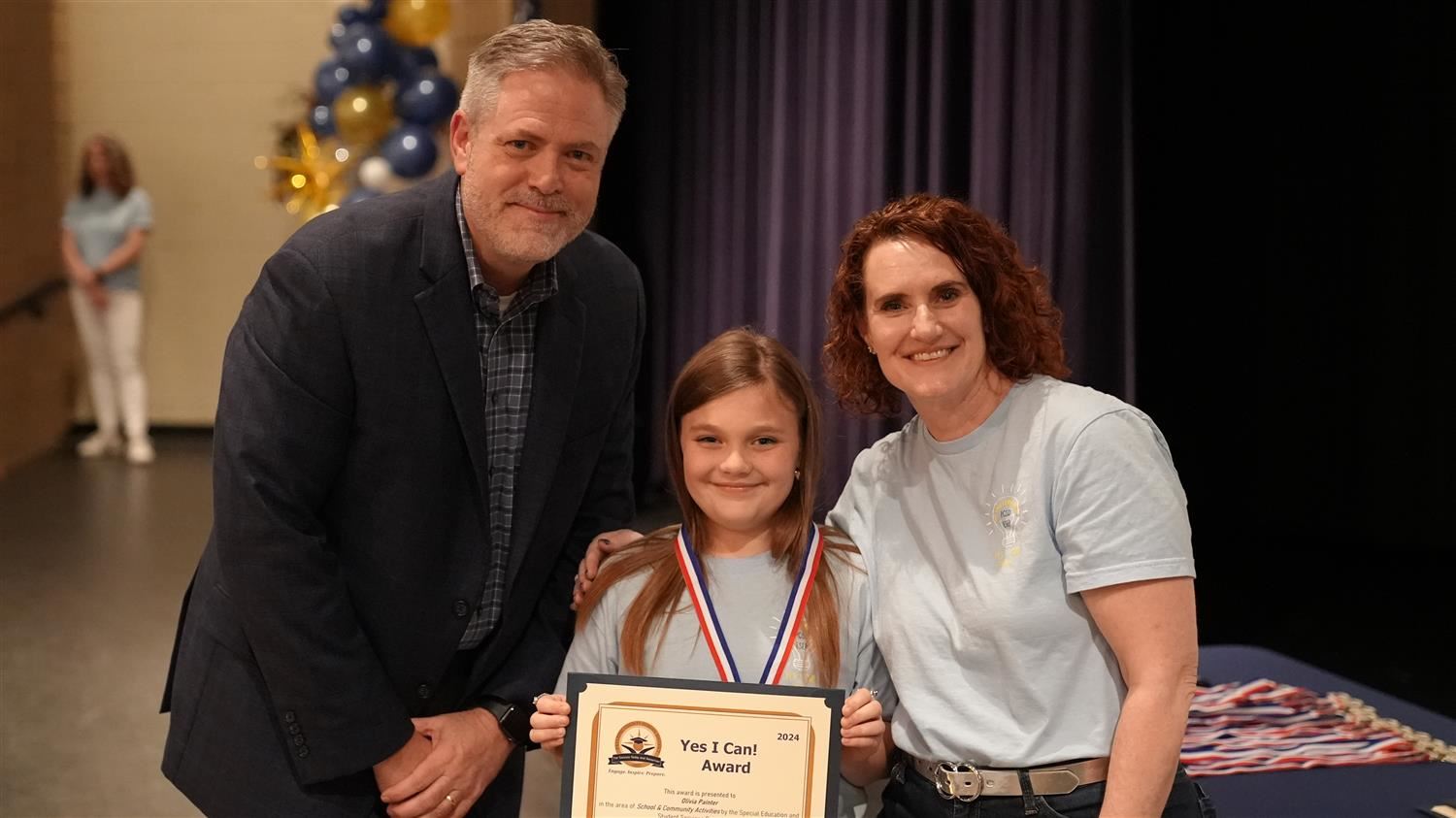 Olivia Painter from Northside ES pictured with Superintendent Steve Barnette and Senior Executive Director of Student Service