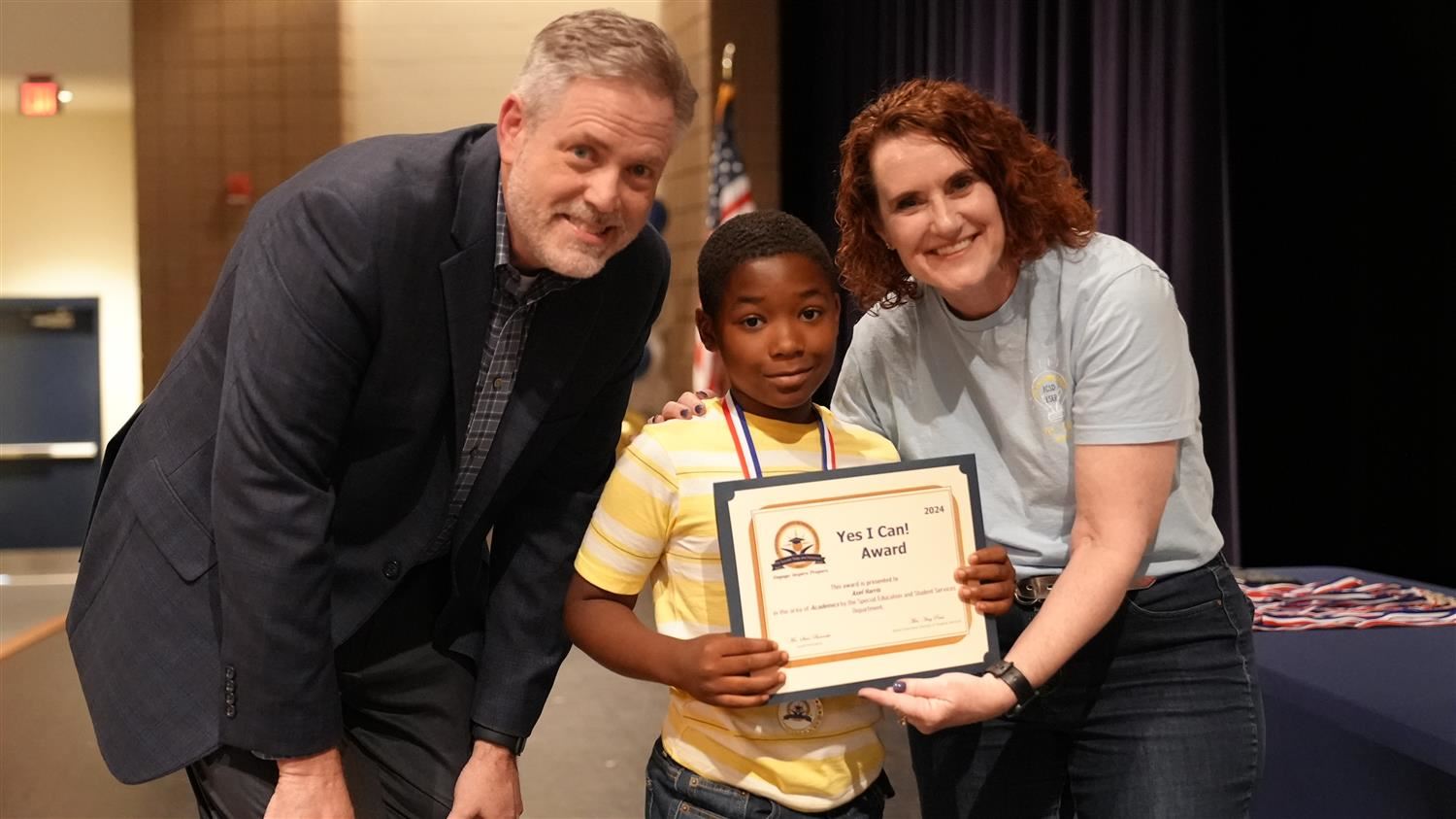 Axel Harris from Panter ES pictured with Superintendent Steve Barnette and Senior Executive Director of Student Services Amy 