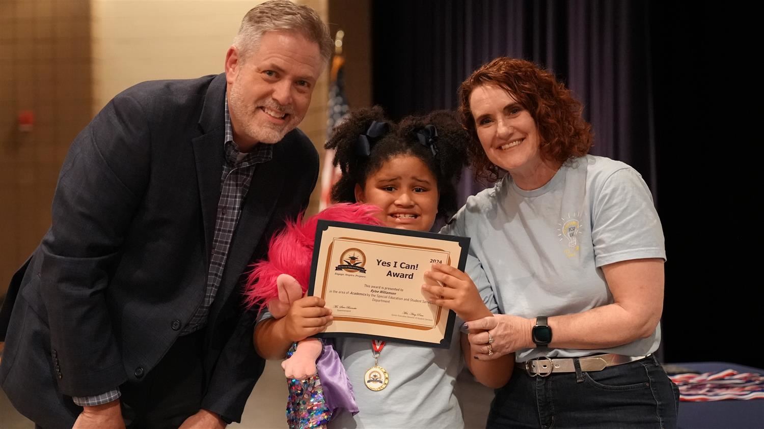 Rylee Williamson from Panter ES pictured with Superintendent Steve Barnette and Senior Executive Director of Student Services Amy Penn