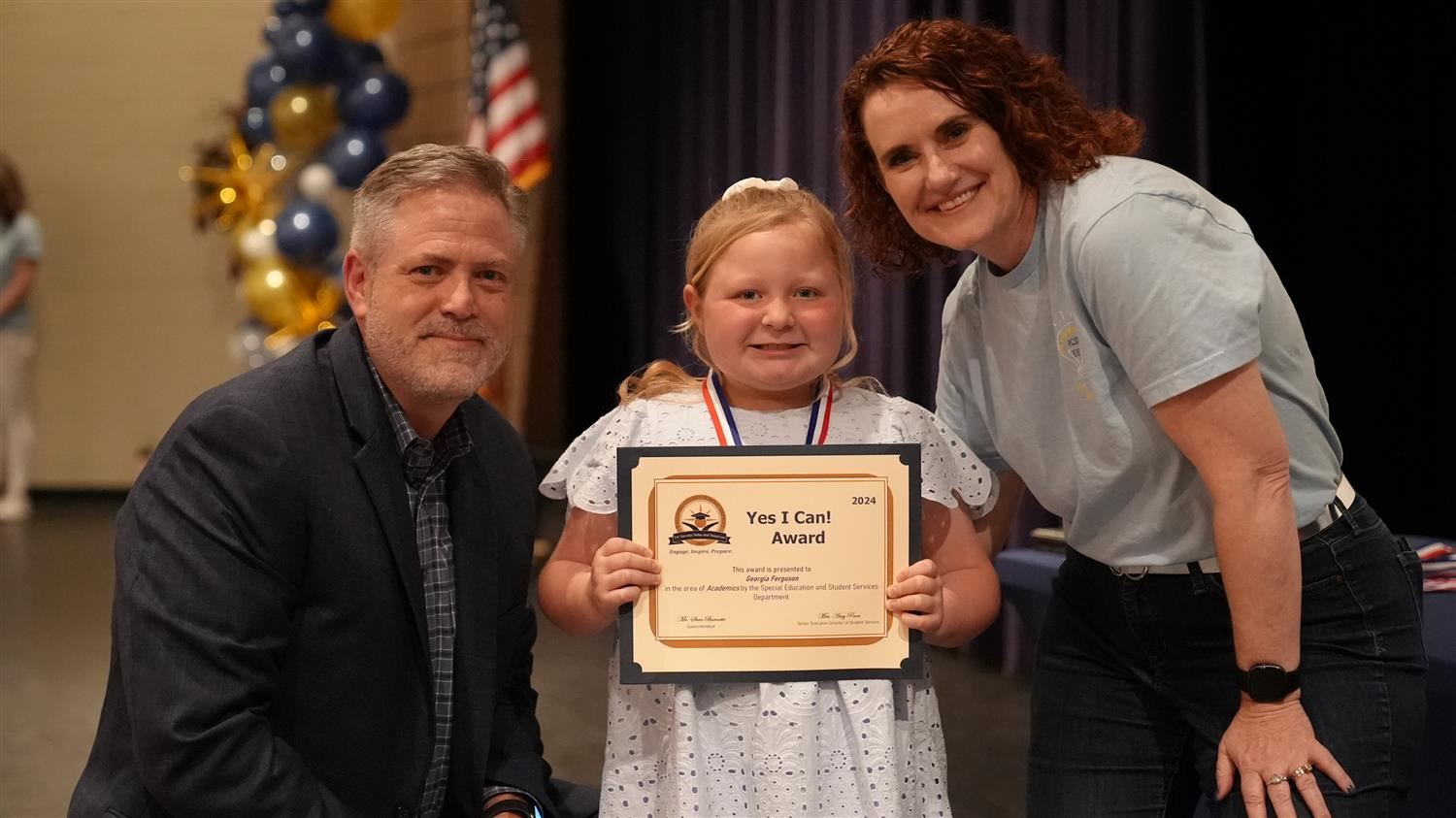 Georgia Ferguson from Ragsdale ES pictured with Superintendent Steve Barnette and Senior Executive Director of Student Servic