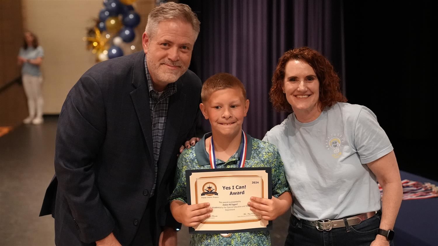 Oakley McTaggart from Ragsdale ES pictured with Superintendent Steve Barnette and Senior Executive Director of Student Servic