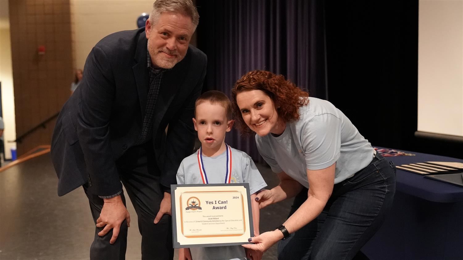 Jacob Hilliard from Russom ES pictured with Superintendent Steve Barnette and Senior Executive Director of Student Services A
