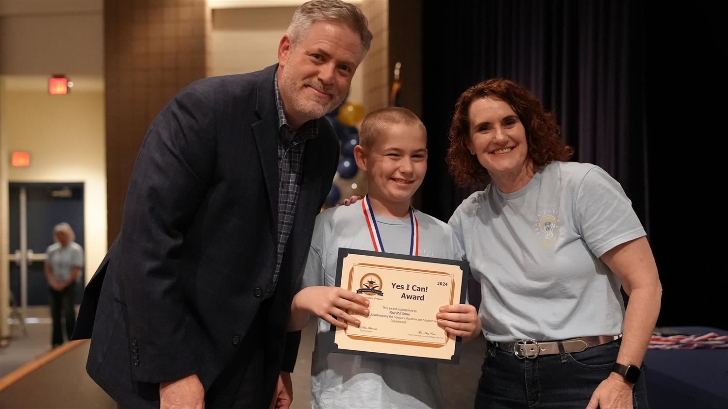 Paul (PJ) Tellini from Russom ES pictured with Superintendent Steve Barnette and Senior Executive Director of Student Service