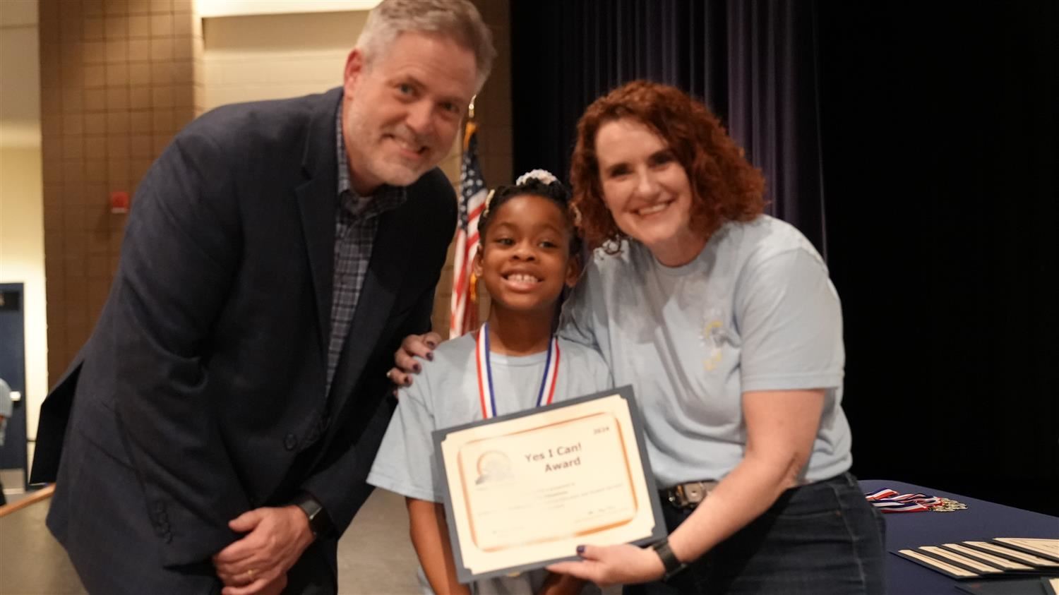 Elina Edosomwan from Shelton ES pictured with Superintendent Steve Barnette and Senior Executive Director of Student Services