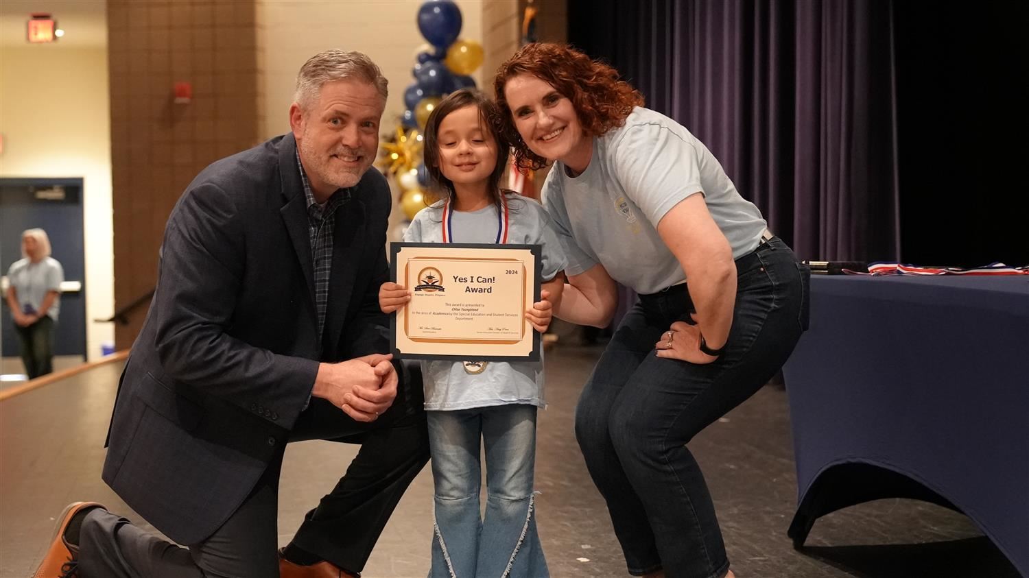 Chloe Youngblood from Shelton ES pictured with Superintendent Steve Barnette and Senior Executive Director of Student Service
