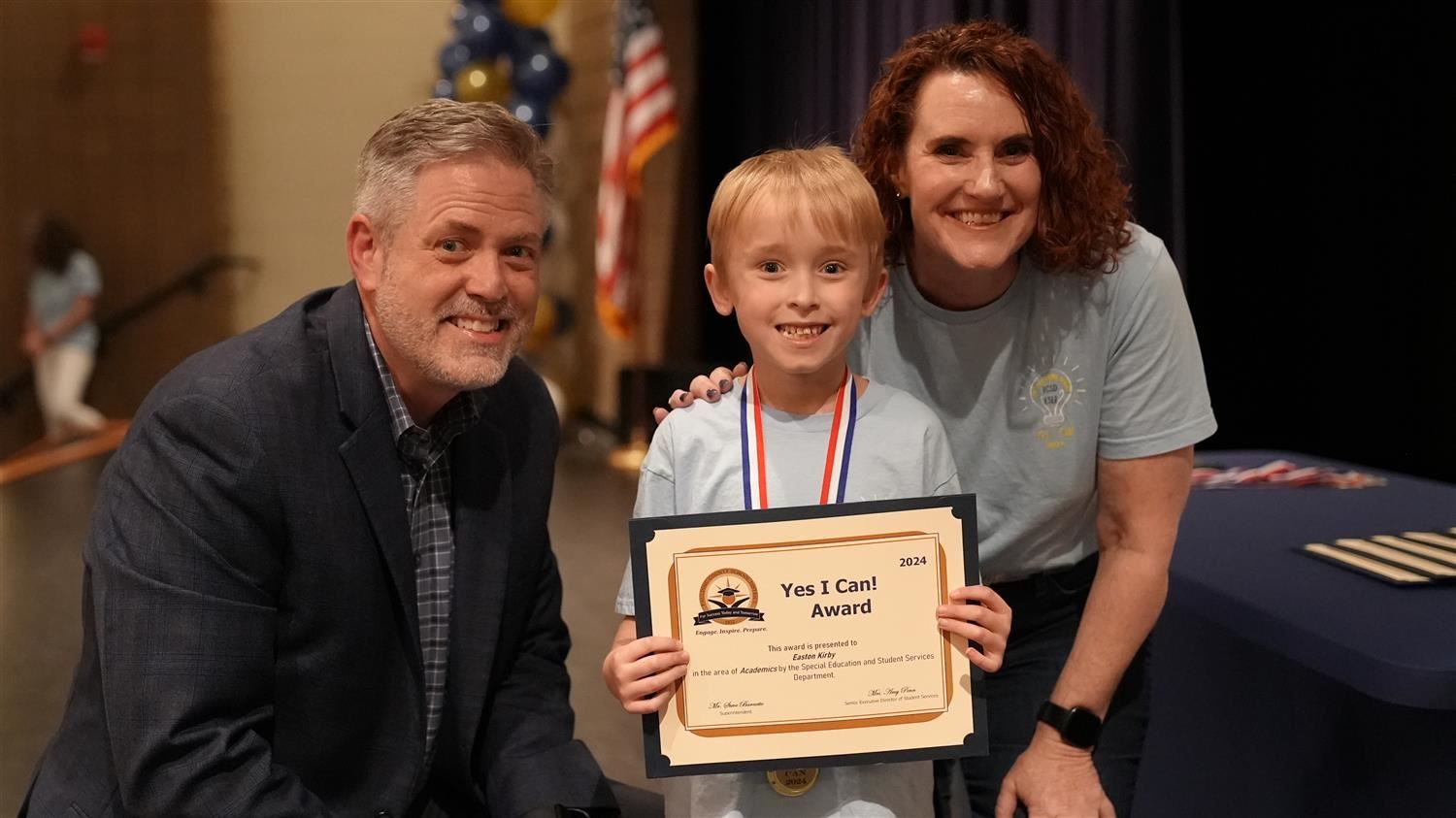 Easton Kirby from Union ES pictured with Superintendent Steve Barnette and Senior Executive Director of Student Services Amy 