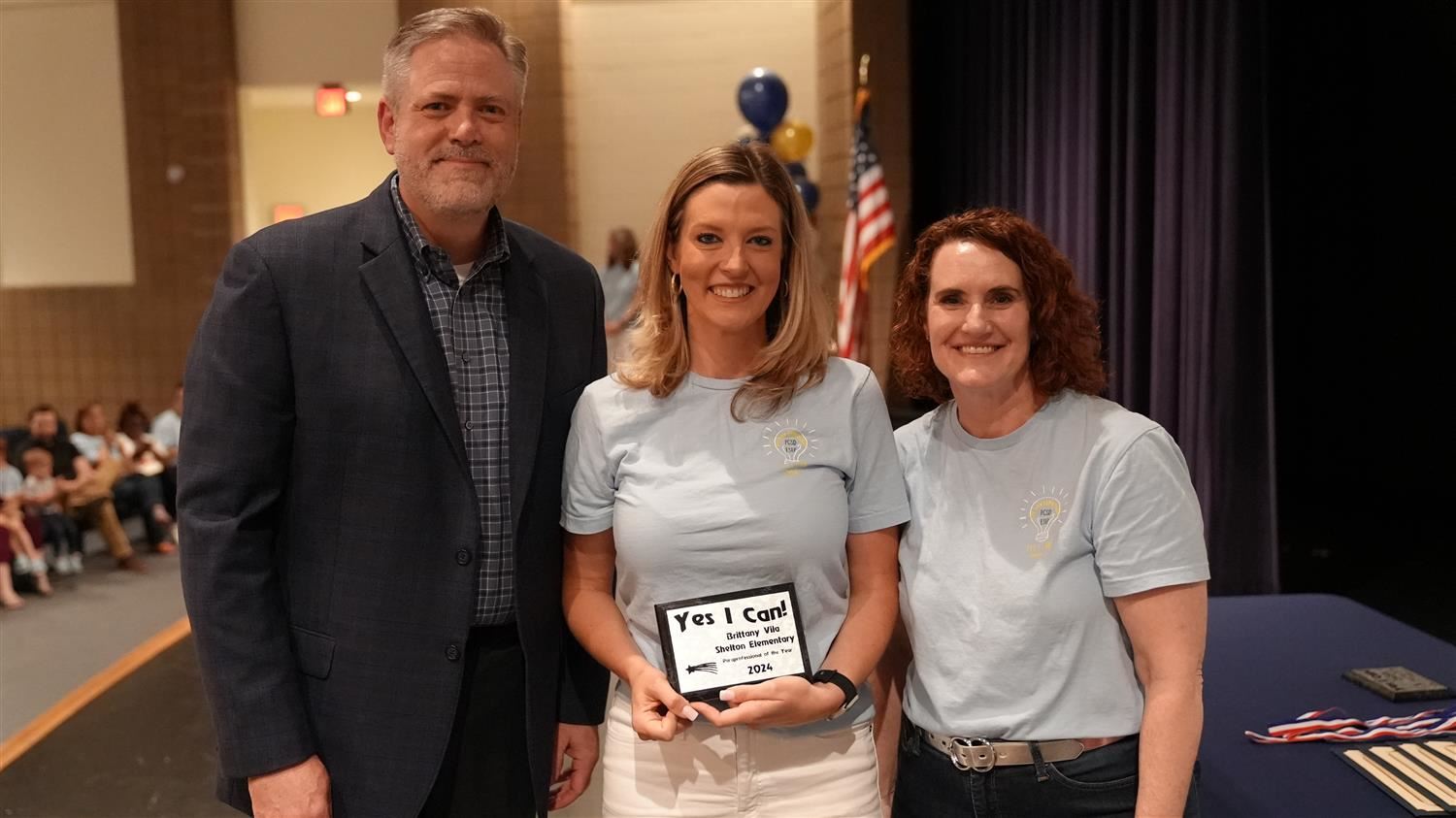 Paraprofessional of the Year winner Brittany Vila from Shelton ES pictured with Superintendent Steve Barnette and Senior Exec