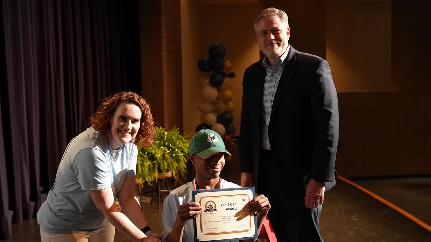 Robert Mosley from Austin Middle School pictured with Senior Amy Penn and Superintendent Steve Barnette