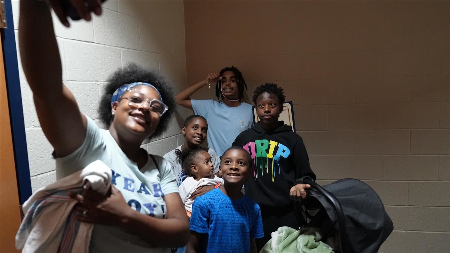 Proud Family taking selfie with Yes I Can winner.
