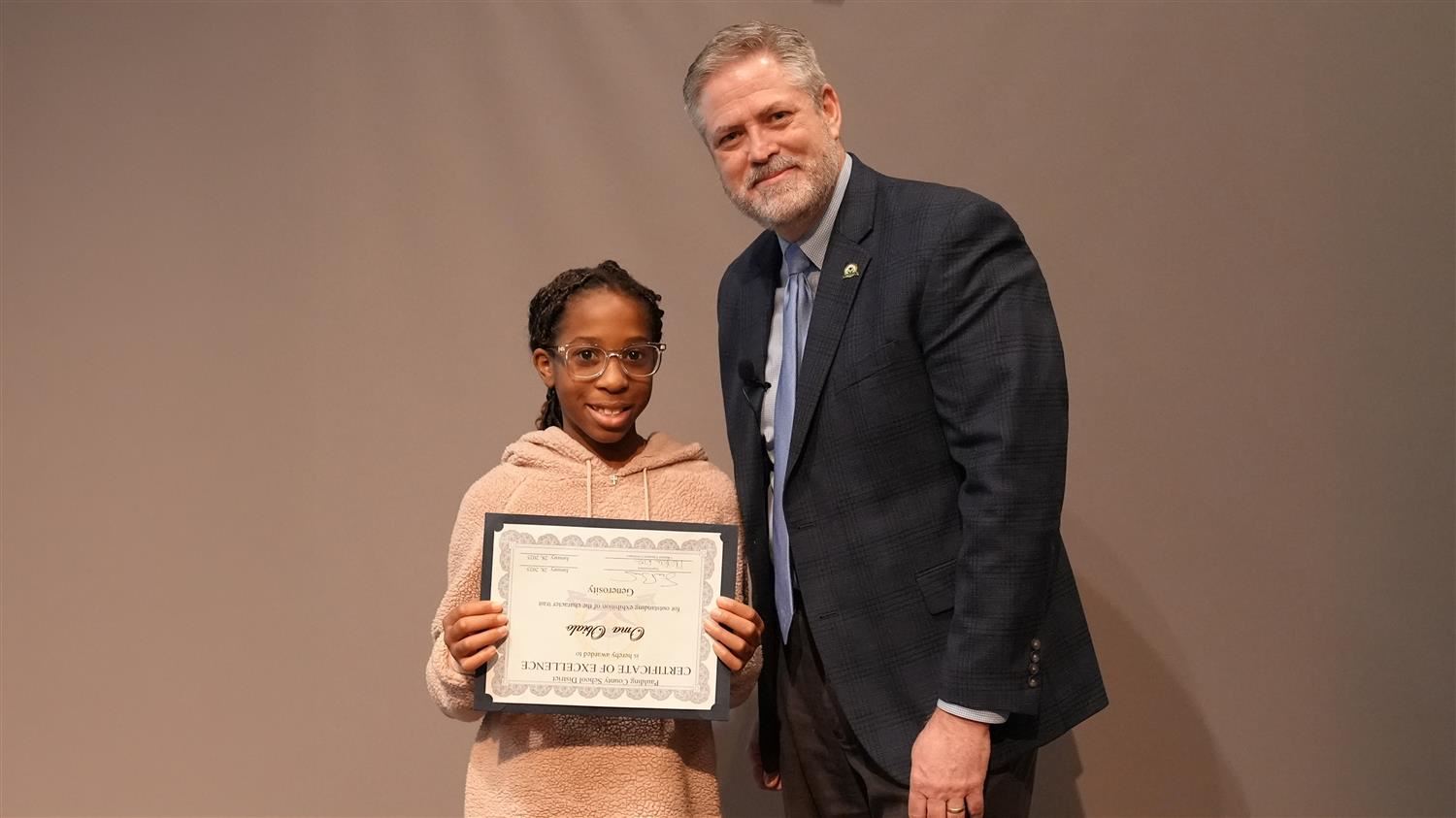 Character In Action - Generosity: Superintendent Steve Barnette and Oma Obialo from Dallas Elementary.
