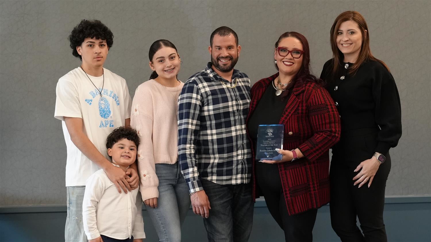 2025 PCSD Teacher of the Year Dr. Rosalyn Zabala pictured with her family.